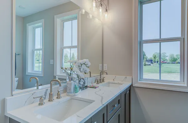 a bathroom with a sink and a large mirror