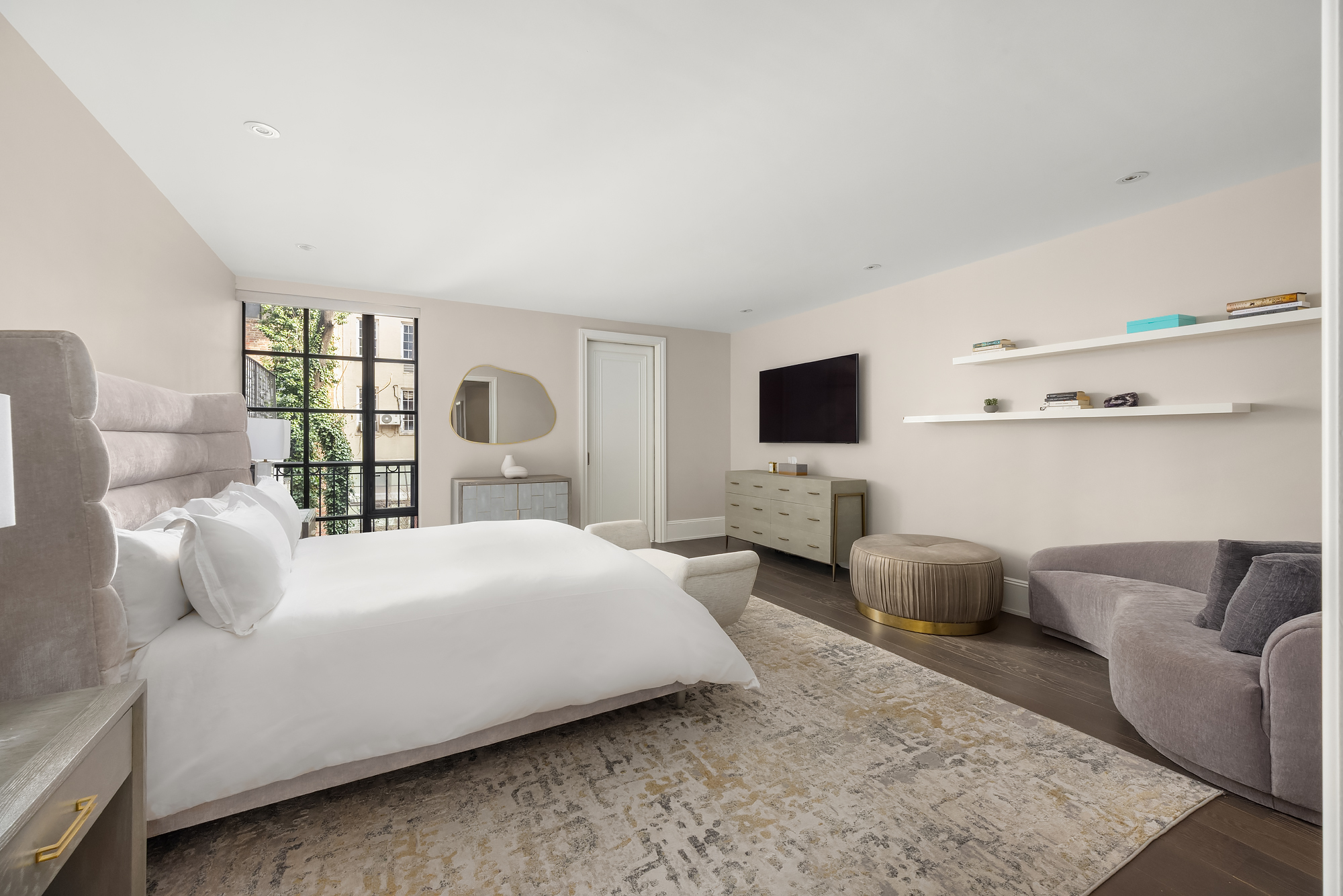 123 East 61st Street Manhattan, NY 10065 - Photo 13 of 31 a bedroom with a bed window and flat screen tv