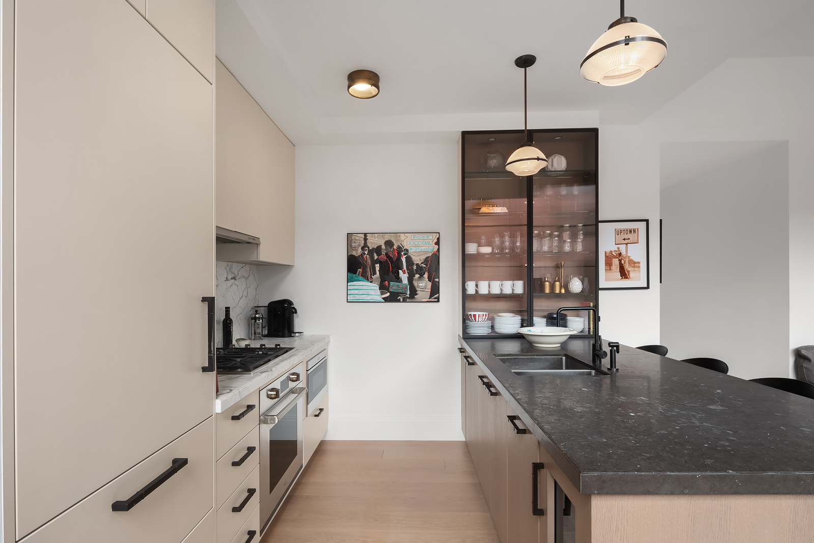 438 East 12th Street, Unit 6F Manhattan, NY 10009 - Photo 4 of 27 a kitchen with granite countertop a sink a stove and cabinets