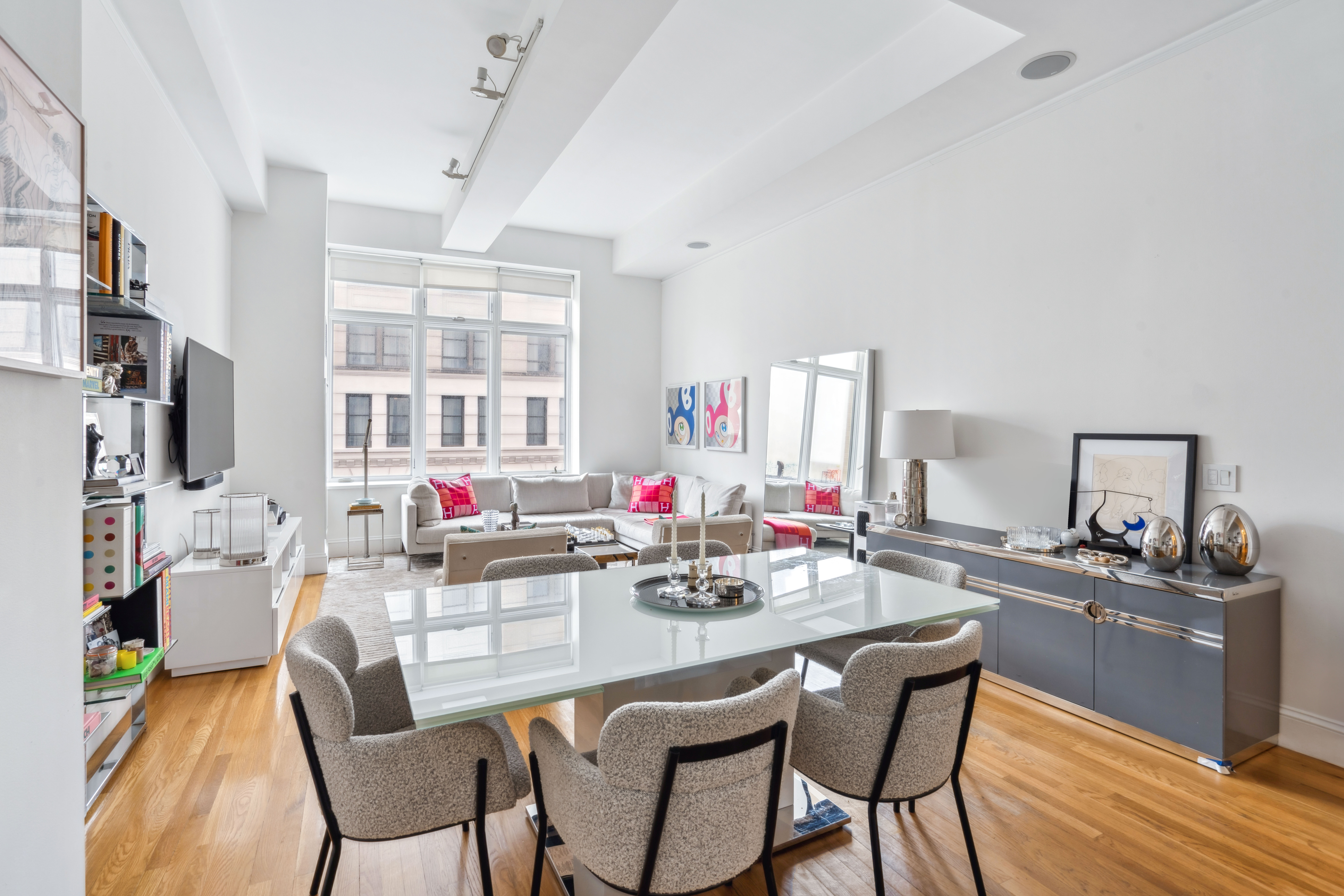 129 Lafayette Street, Unit 3B Manhattan, NY 10013 - Photo 4 of 13 a view of a dining room with furniture and chandelier
