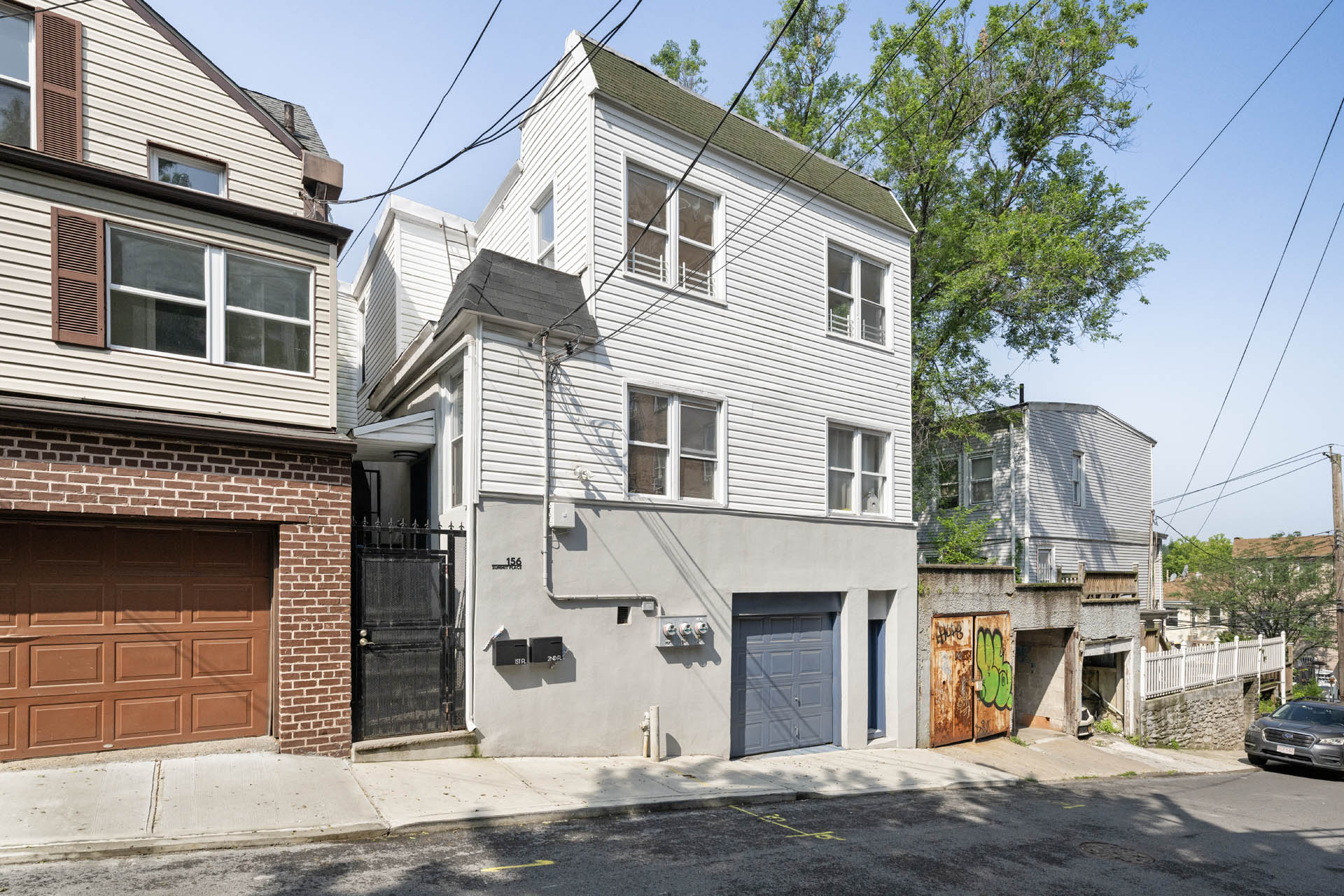 156 Summit Place, Unit 2 Bronx, NY 10463 - Photo 9 of 10 a front view of a house with a garage