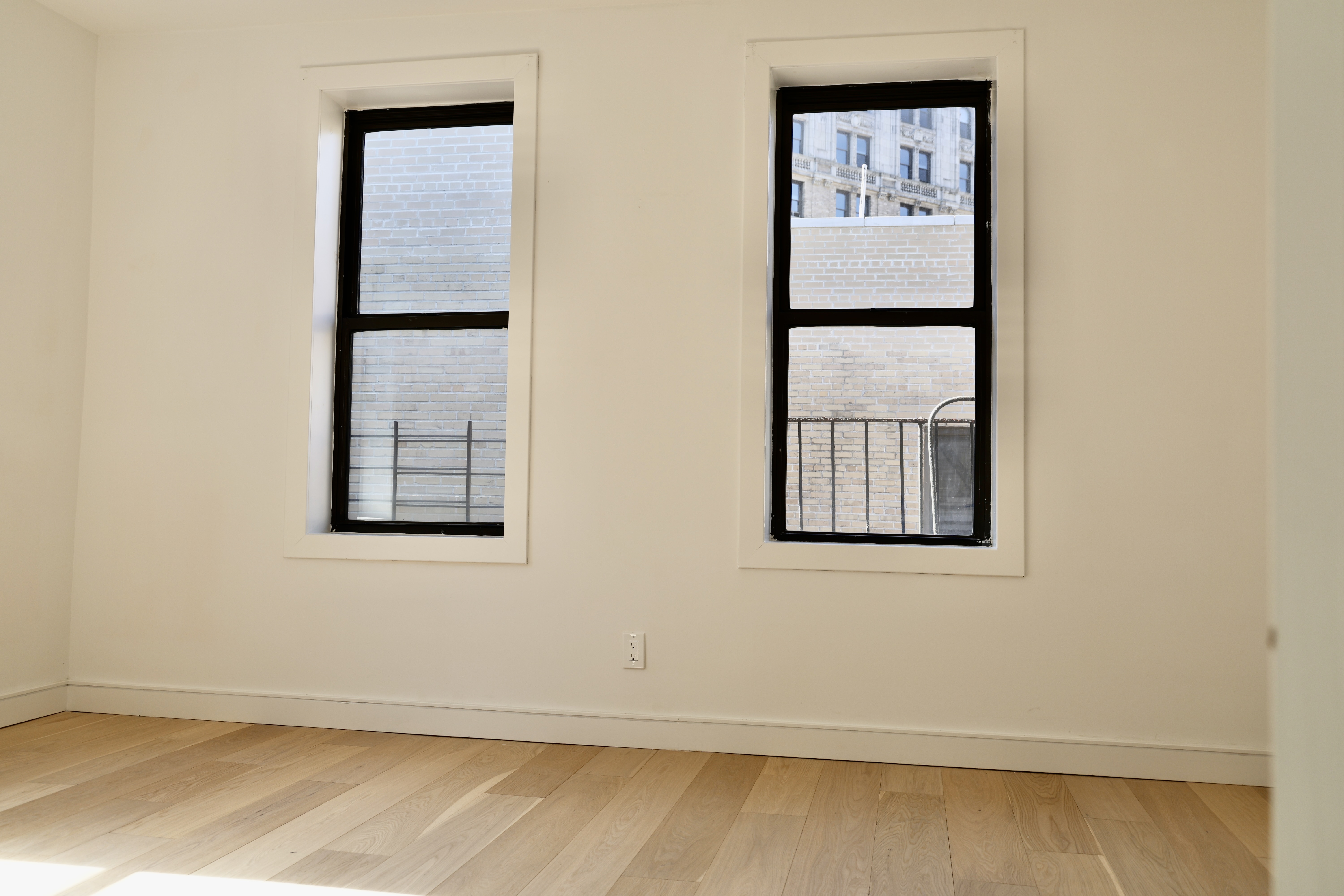 807 Riverside Drive, Unit 6E Manhattan, NY 10032 - Photo 6 of 7 an empty room with windows