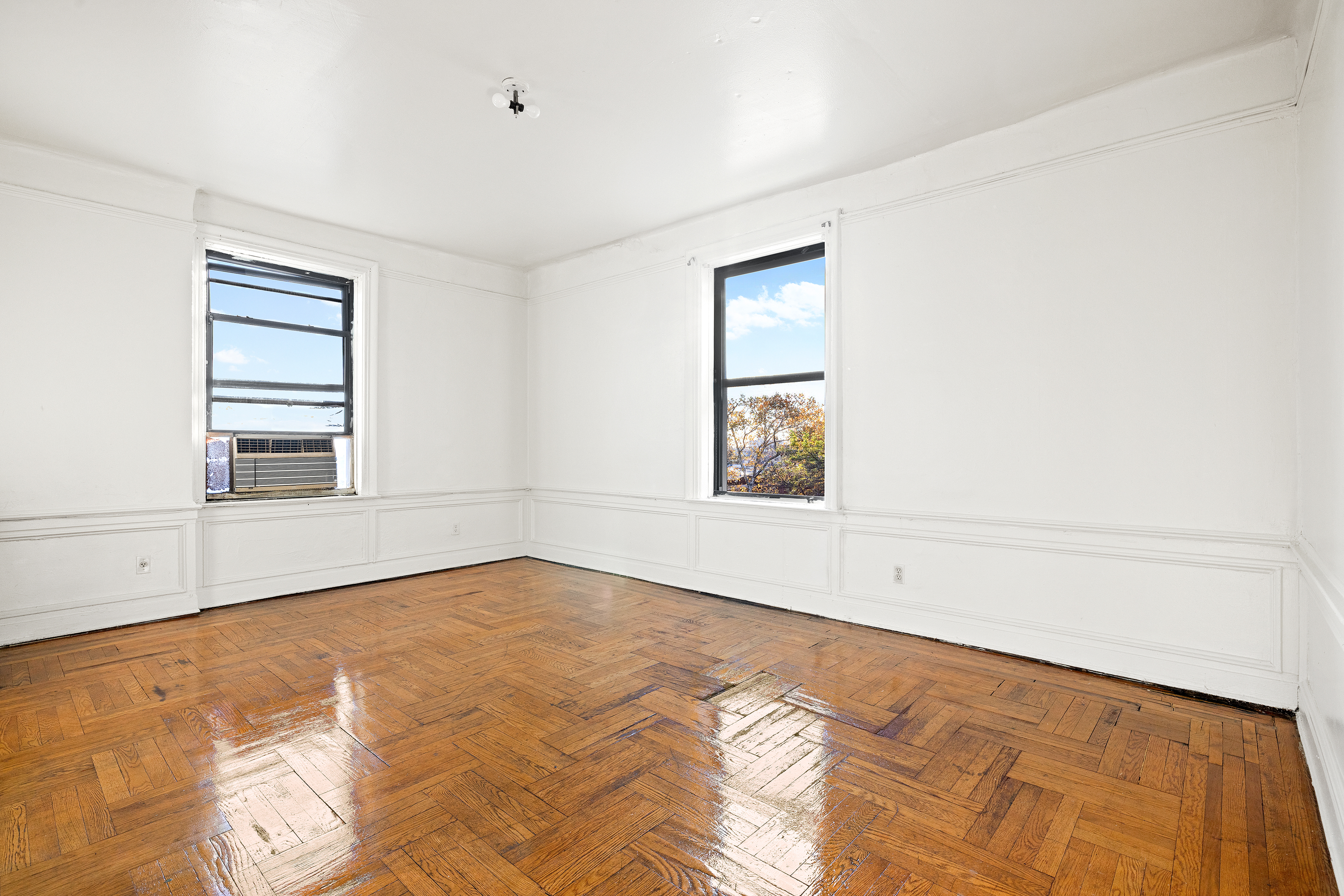 421 Crown Street, Unit 18R Brooklyn, NY 11225 - Photo 2 of 8 a view of an empty room with a window