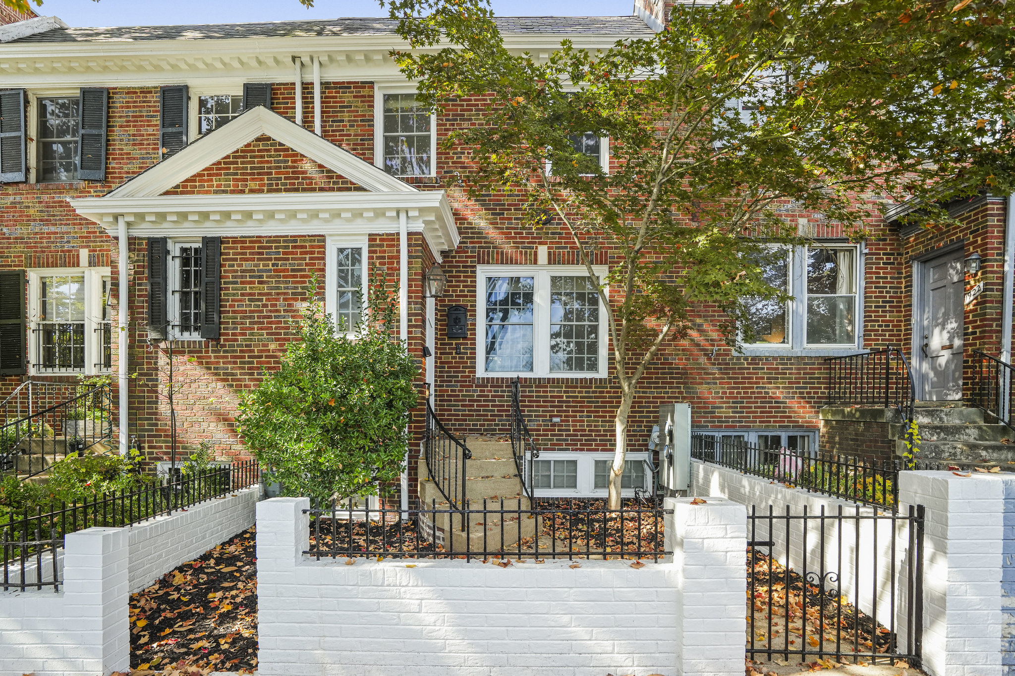 a front view of a house with a porch