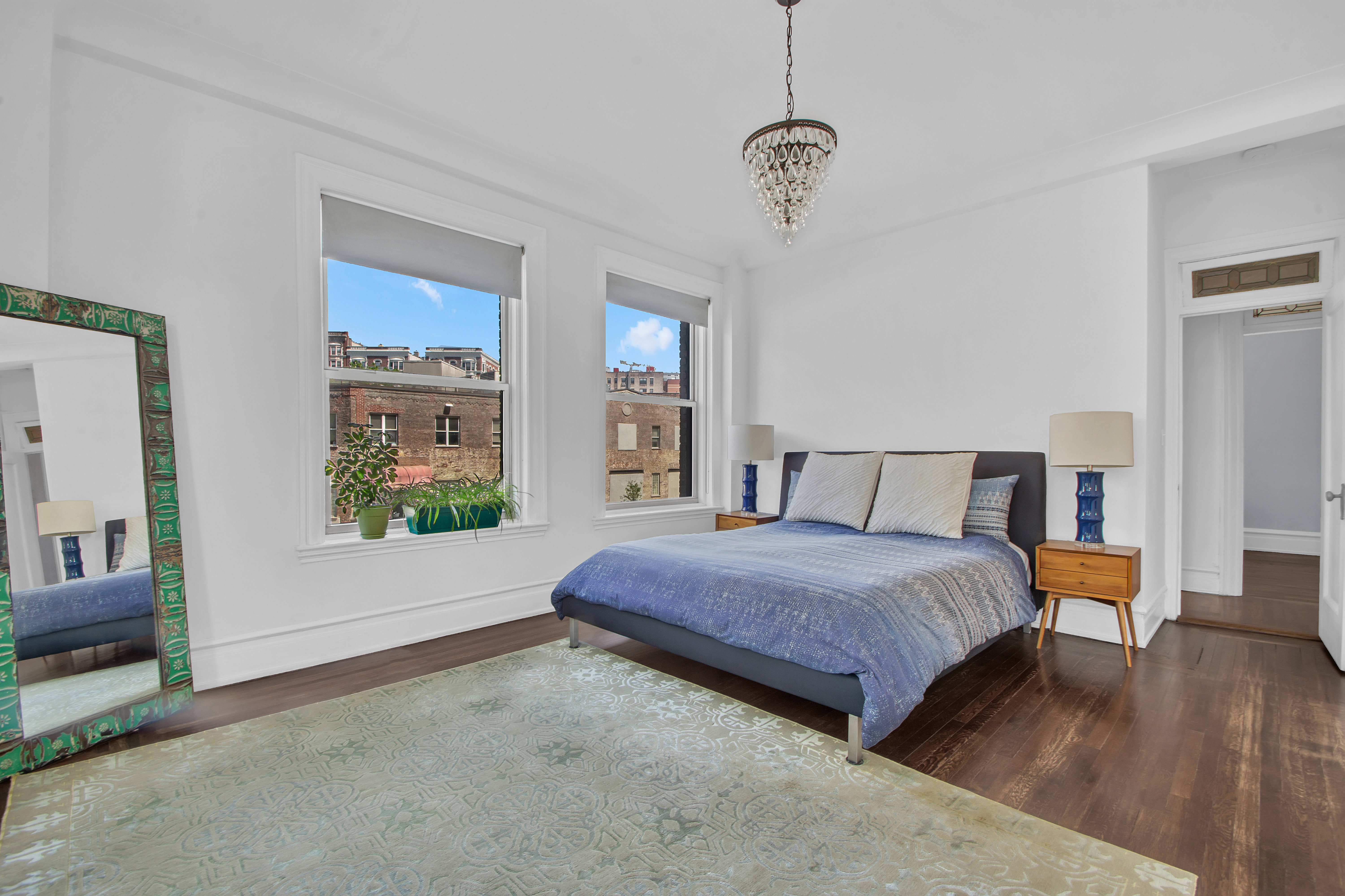 800 Riverside Drive, Unit 2E Manhattan, NY 10032 - Photo 12 of 27 a bedroom with a bed and a window