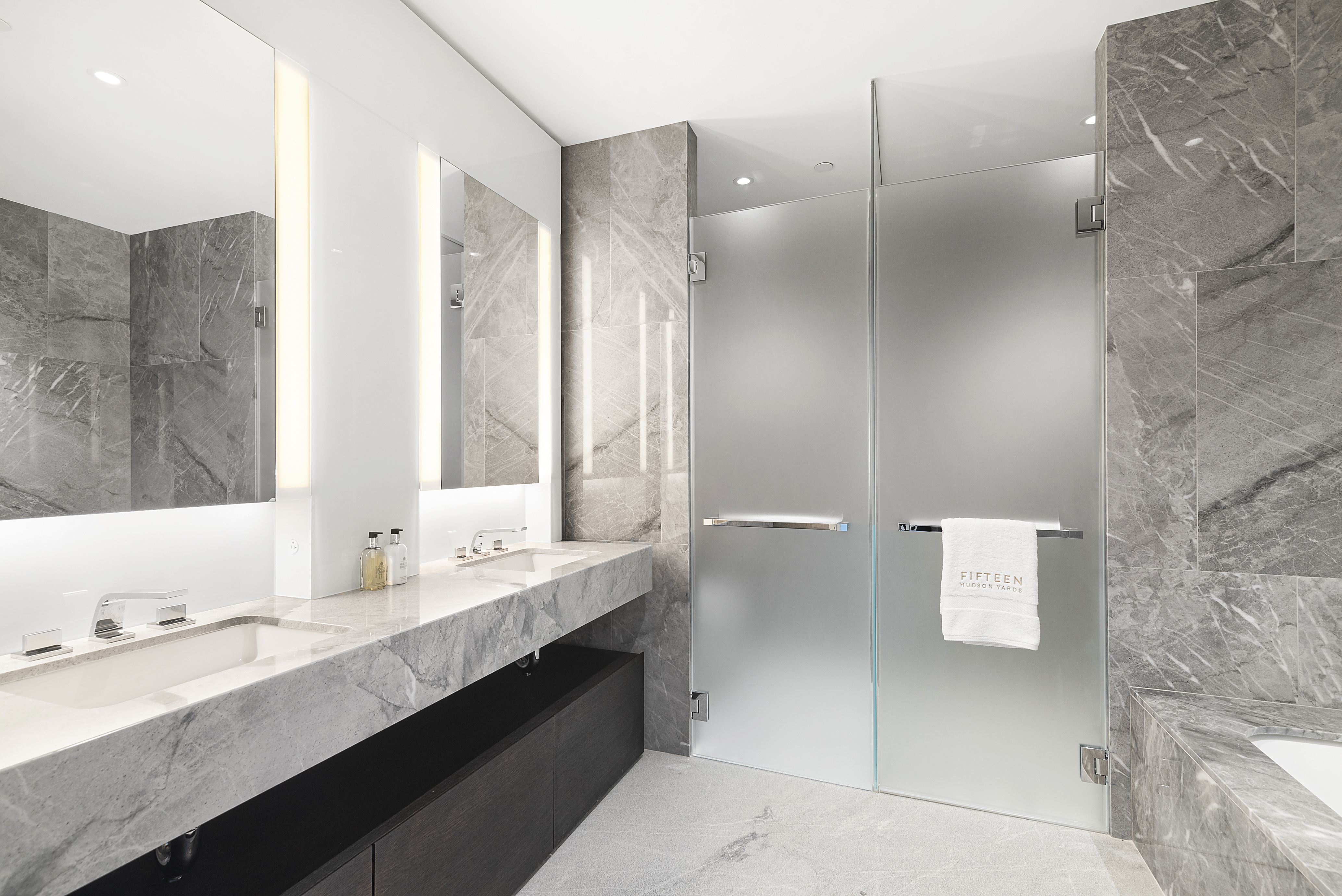 15 Hudson Yards, Unit 66F Manhattan, NY 10001 - Photo 5 of 23 a bathroom with a double vanity sink mirror and double