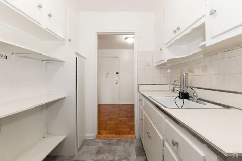 a bathroom with a sink and a shower