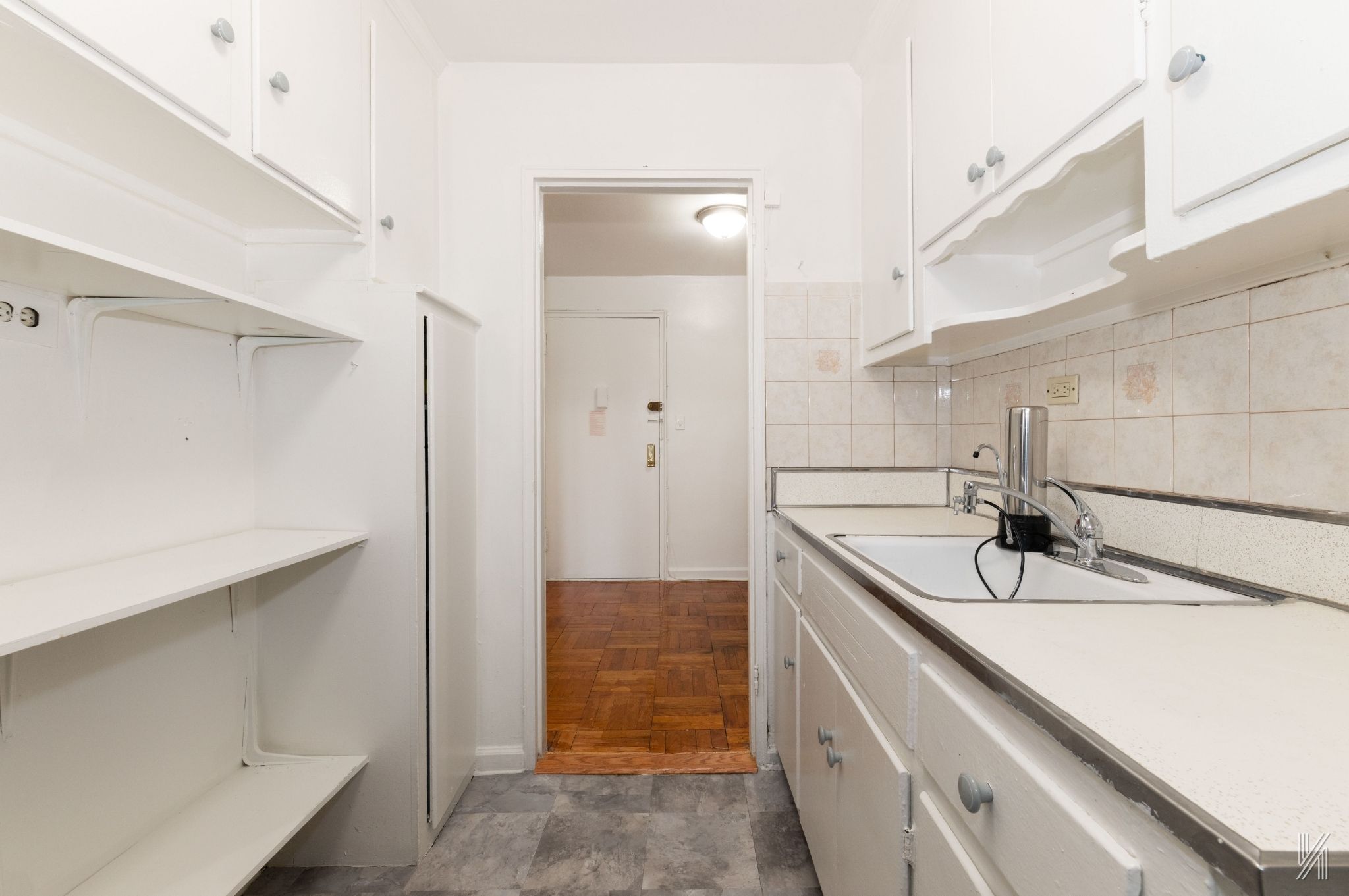 33-24 Junction Boulevard, Unit 1R Queens, NY 11372 - Photo 8 of 17 a bathroom with a sink and a shower