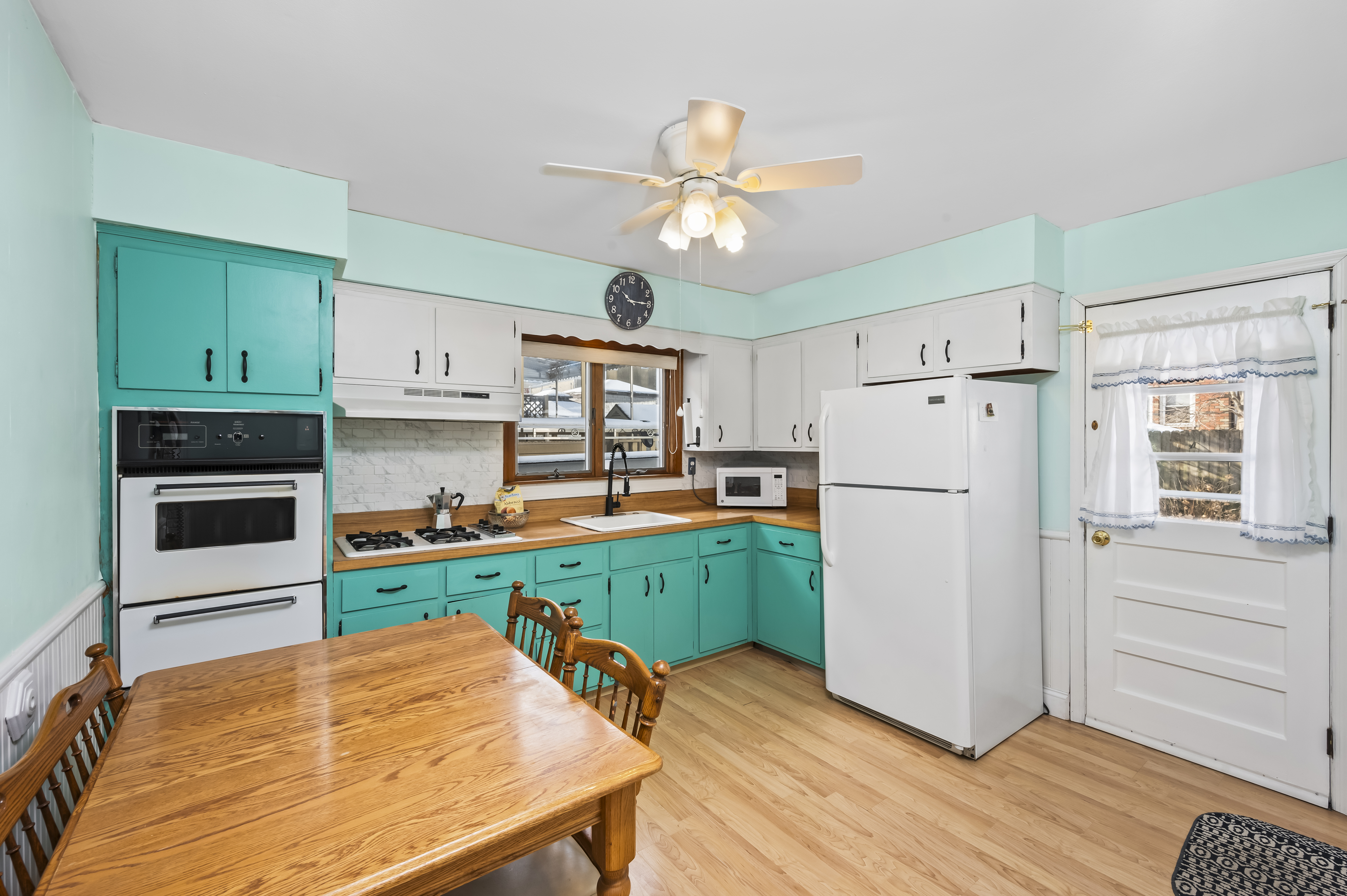 15 Area Place Staten Island, NY 10314 - Photo 9 of 27 a kitchen with a refrigerator a stove cabinets and wooden floor