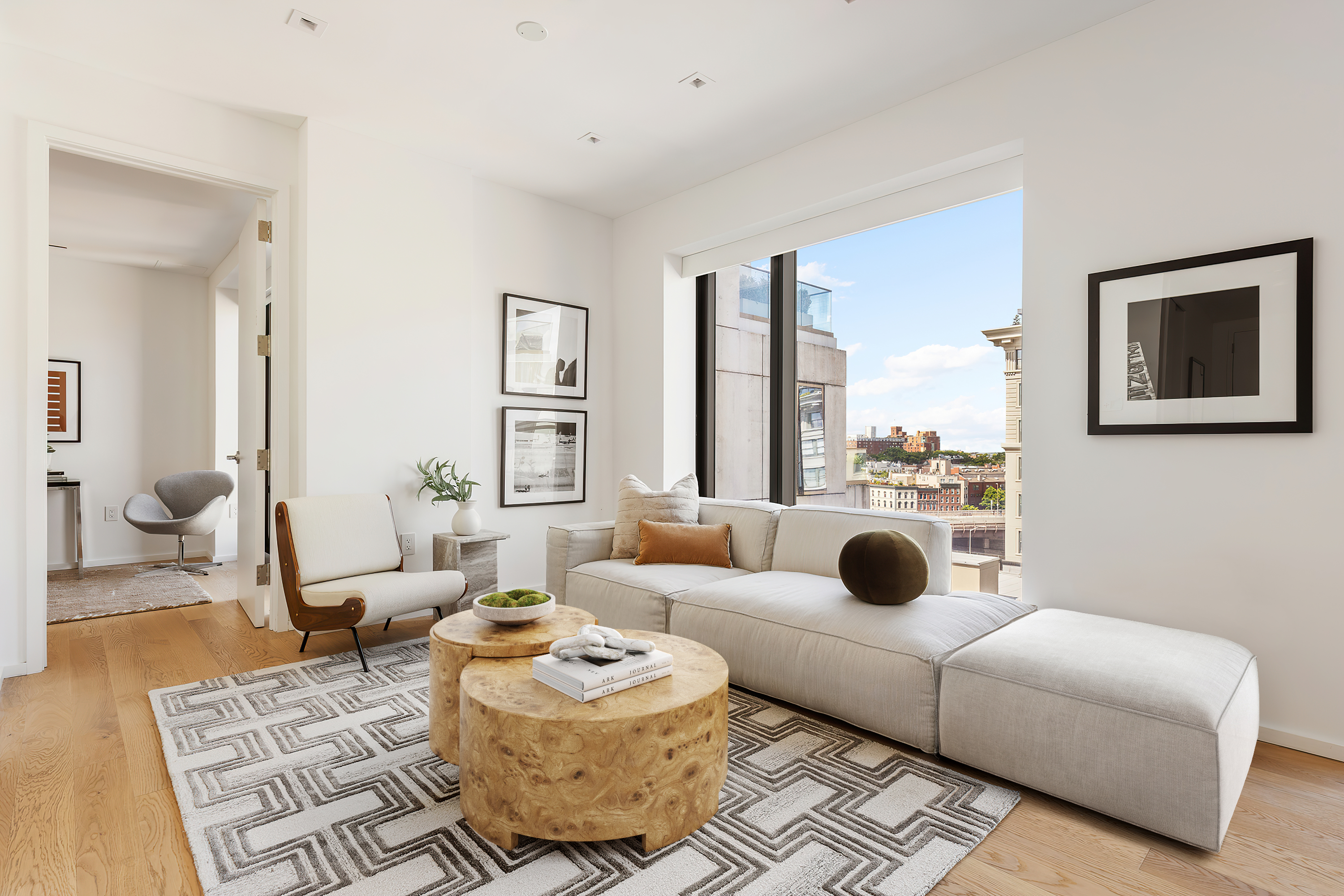 98 Front Street, Unit PH3G Brooklyn, NY 11201 - Photo 2 of 12 a living room with furniture and a large window