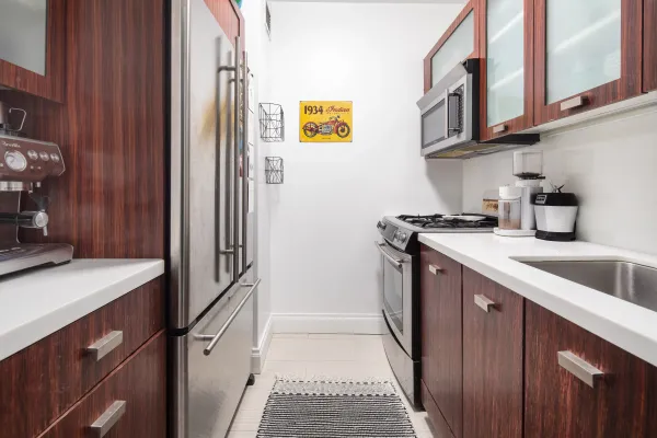a kitchen with stainless steel appliances granite countertop a sink and cabinets
