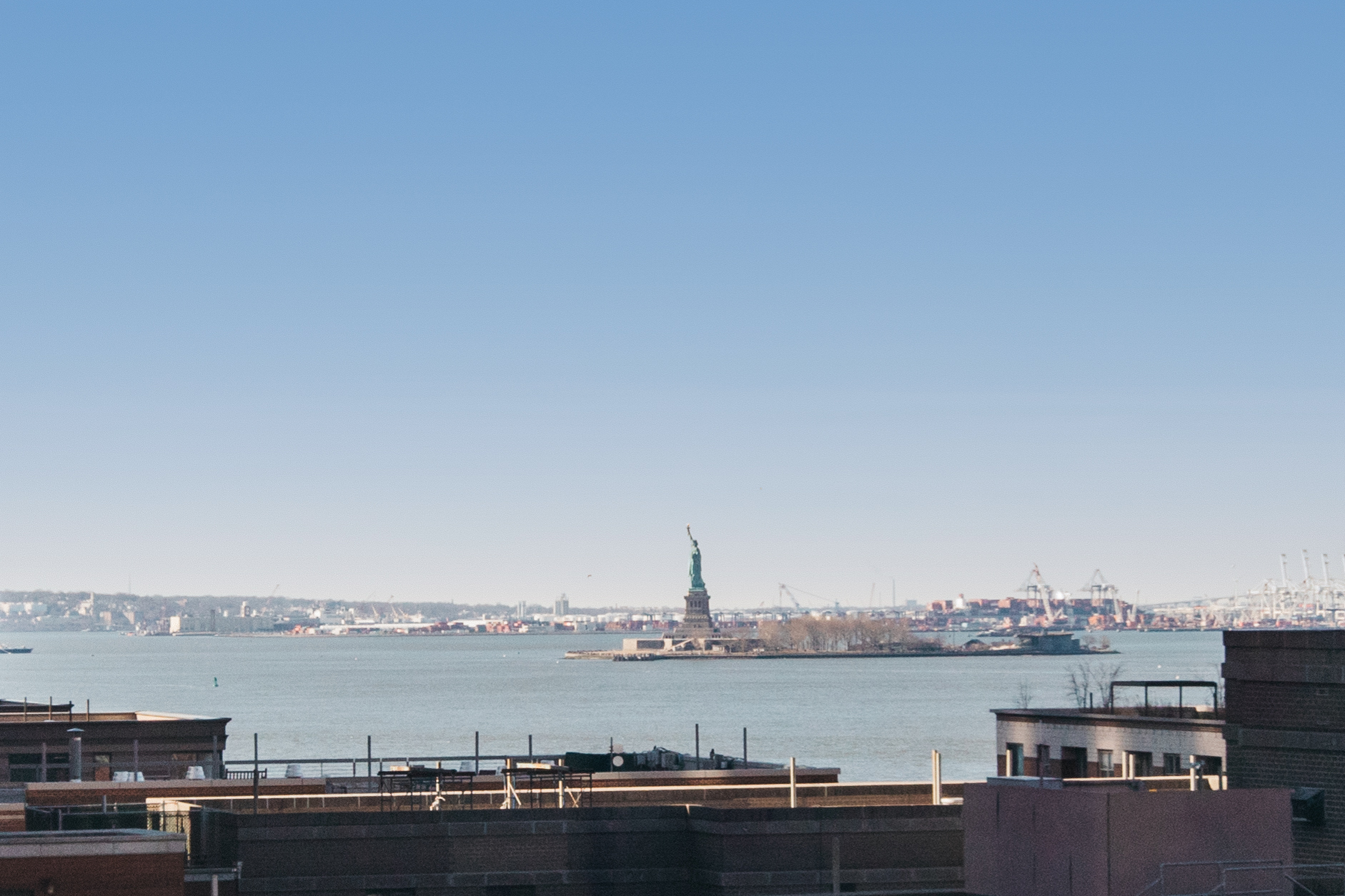 225 Rector Place, Unit 12F Manhattan, NY 10280 - Photo 2 of 7 a view of a lake with a city skyline in the background