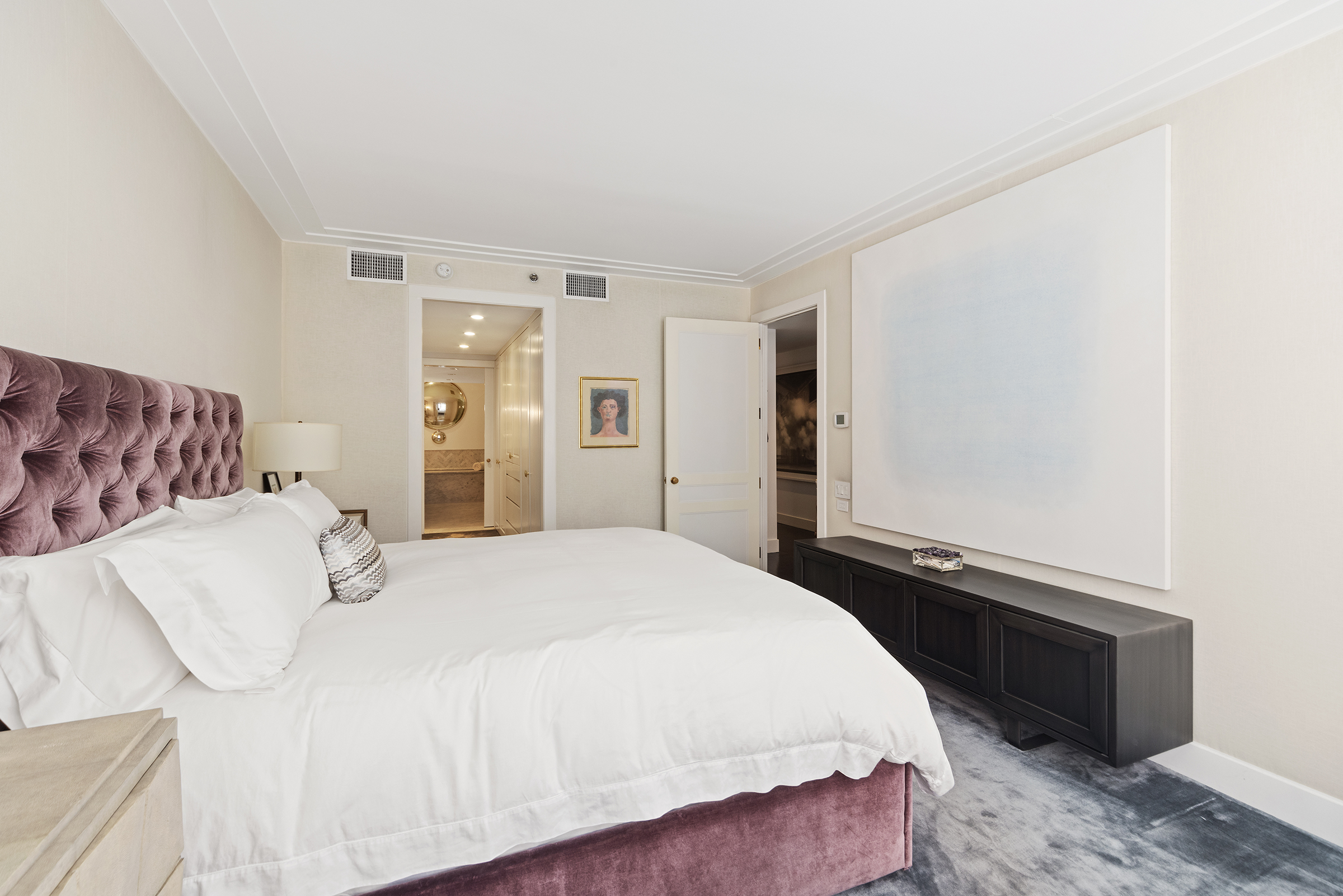 109 Greene Street, Unit 2C Manhattan, NY 10012 - Photo 6 of 13 a bedroom with a bed and a refrigerator