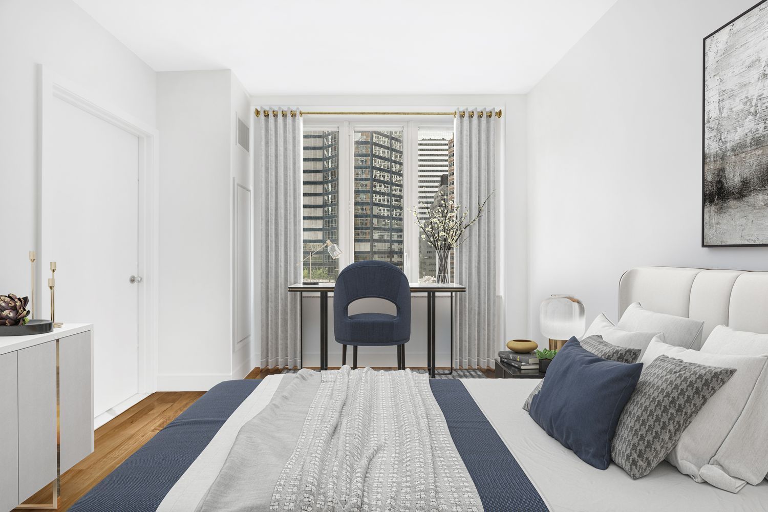 250 East 53rd Street, Unit 1001 Manhattan, NY 10022 - Photo 4 of 18 a living room with furniture and a large window