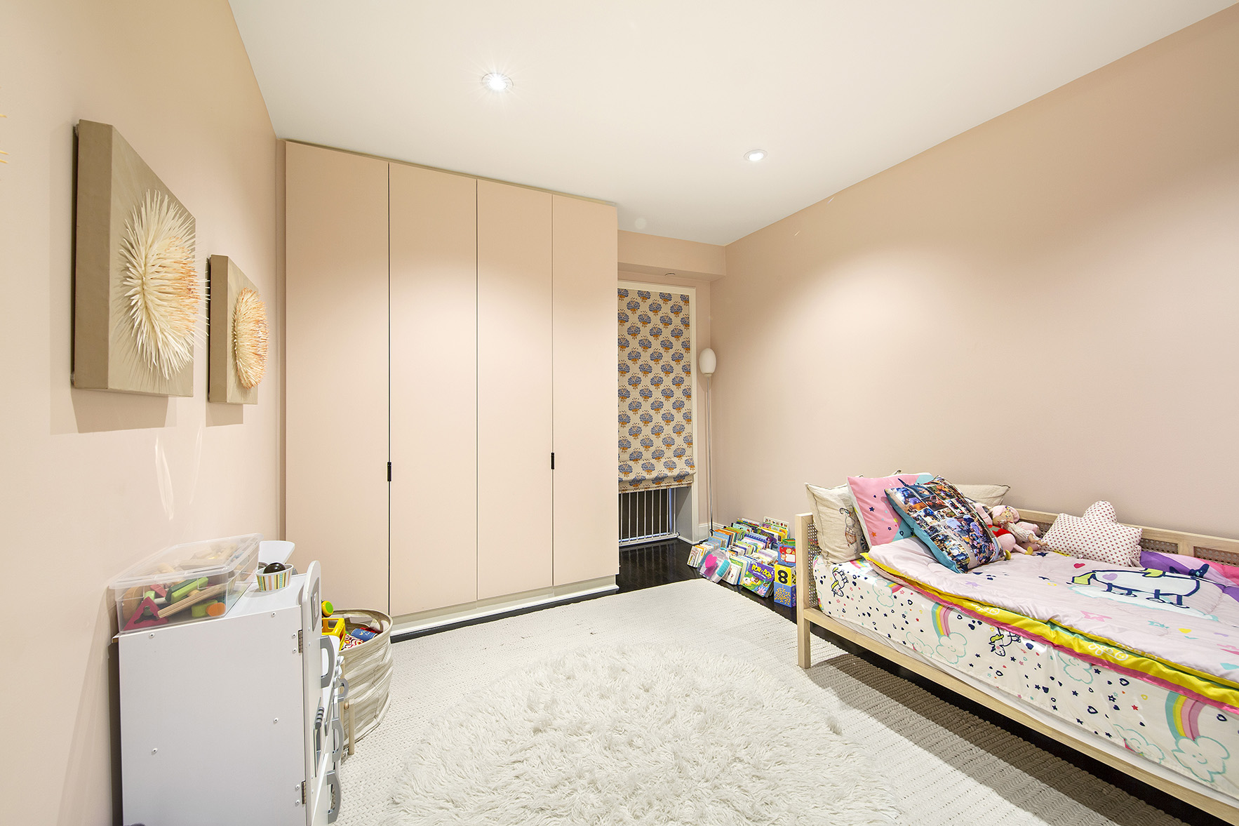 92 Laight Street, Unit 5I Manhattan, NY 10013 - Photo 8 of 12 a bedroom with a bed and a window