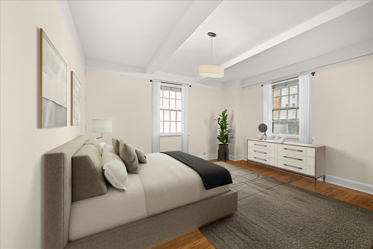 325 East 41st Street, Unit 605 Manhattan, NY 10017 - Photo 4 of 7 a bedroom with bed and windows
