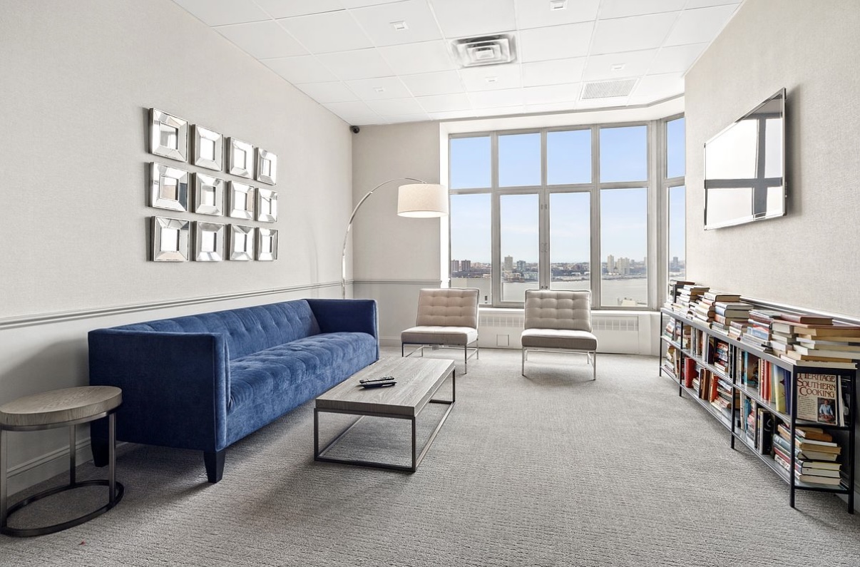 500 West 43rd Street, Unit 4E Manhattan, NY 10036 - Photo 7 of 11 a living room with furniture and a large window with outer view