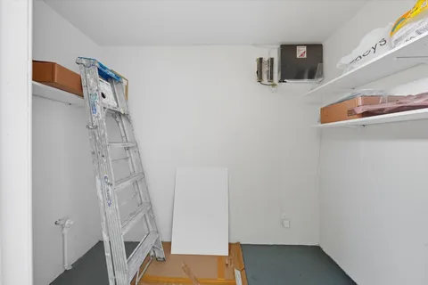 a utility room with cabinets