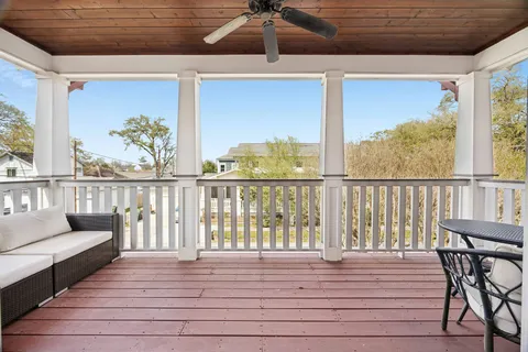 a view of a balcony with furniture