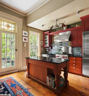 a view of kitchen island with furniture and wooden floor