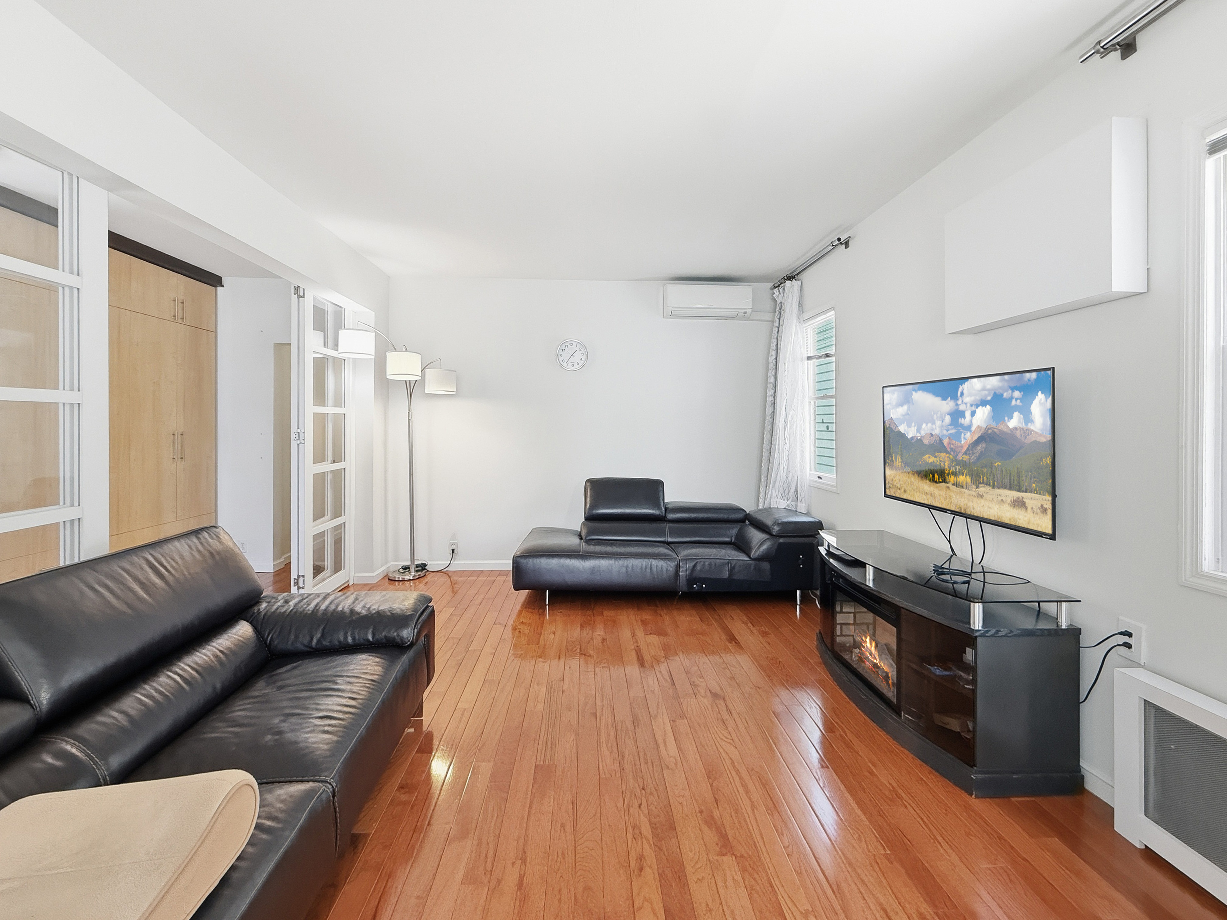3735 Oceanic Avenue Brooklyn, NY 11224 - Photo 5 of 26 a living room with furniture and a flat screen tv