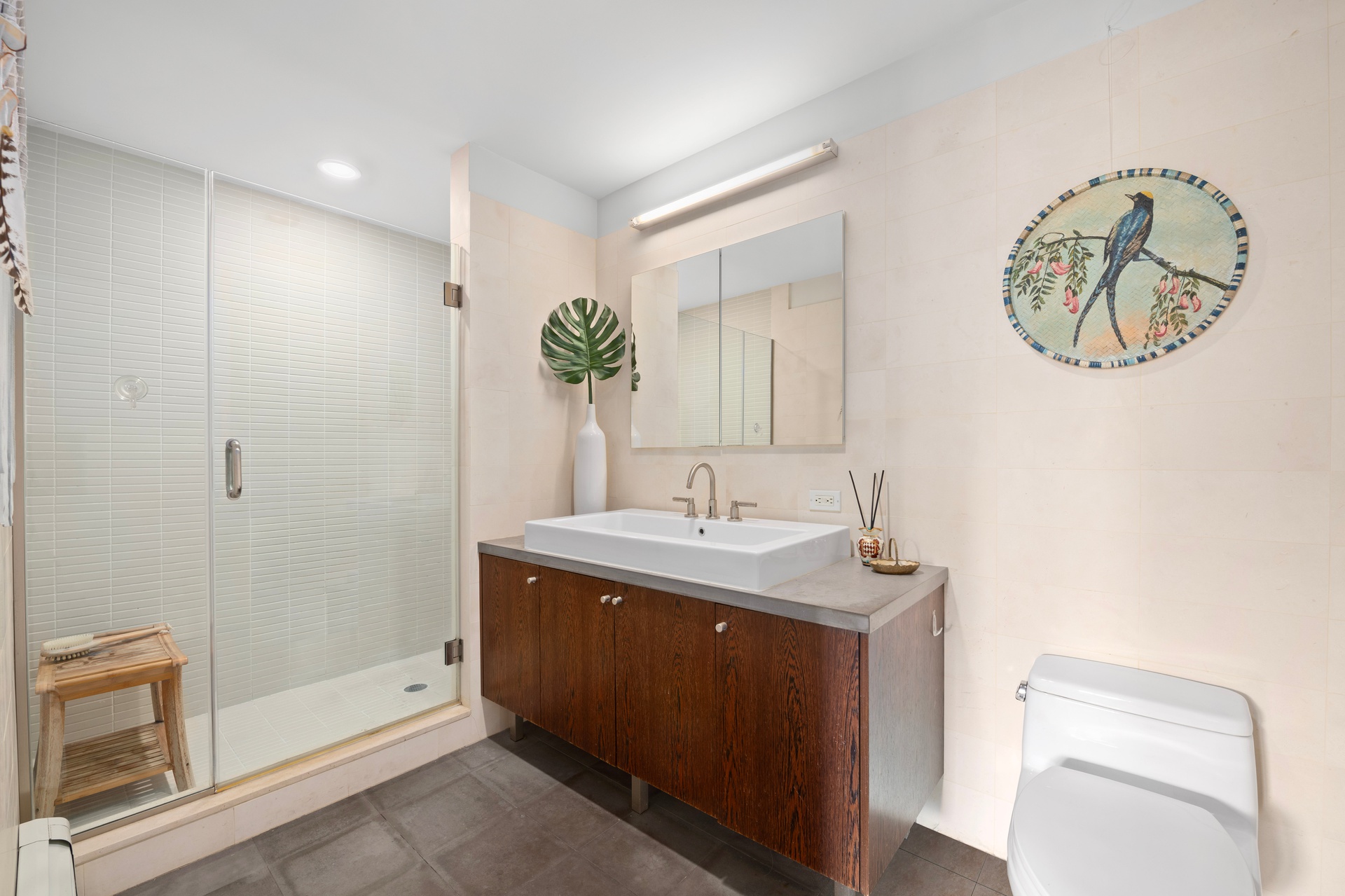26 Broadway, Unit 602 Brooklyn, NY 11249 - Photo 8 of 12 a bathroom with a granite countertop sink a toilet and a mirror