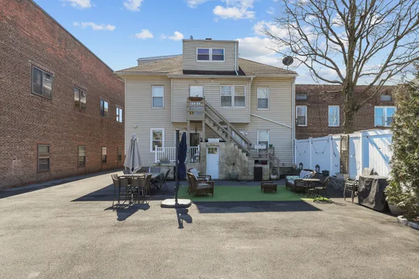 a view of a house with table and chairs