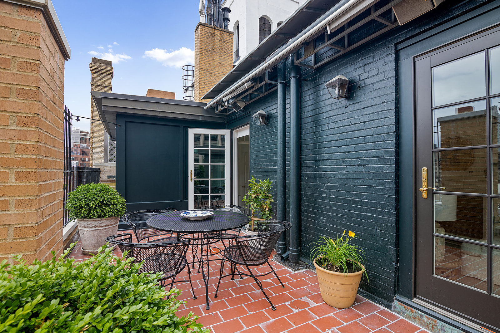 164 East 72nd Street, Unit PHC Manhattan, NY 10021 - Photo 14 of 17 a view of a house with a potted plant and floor to ceiling window