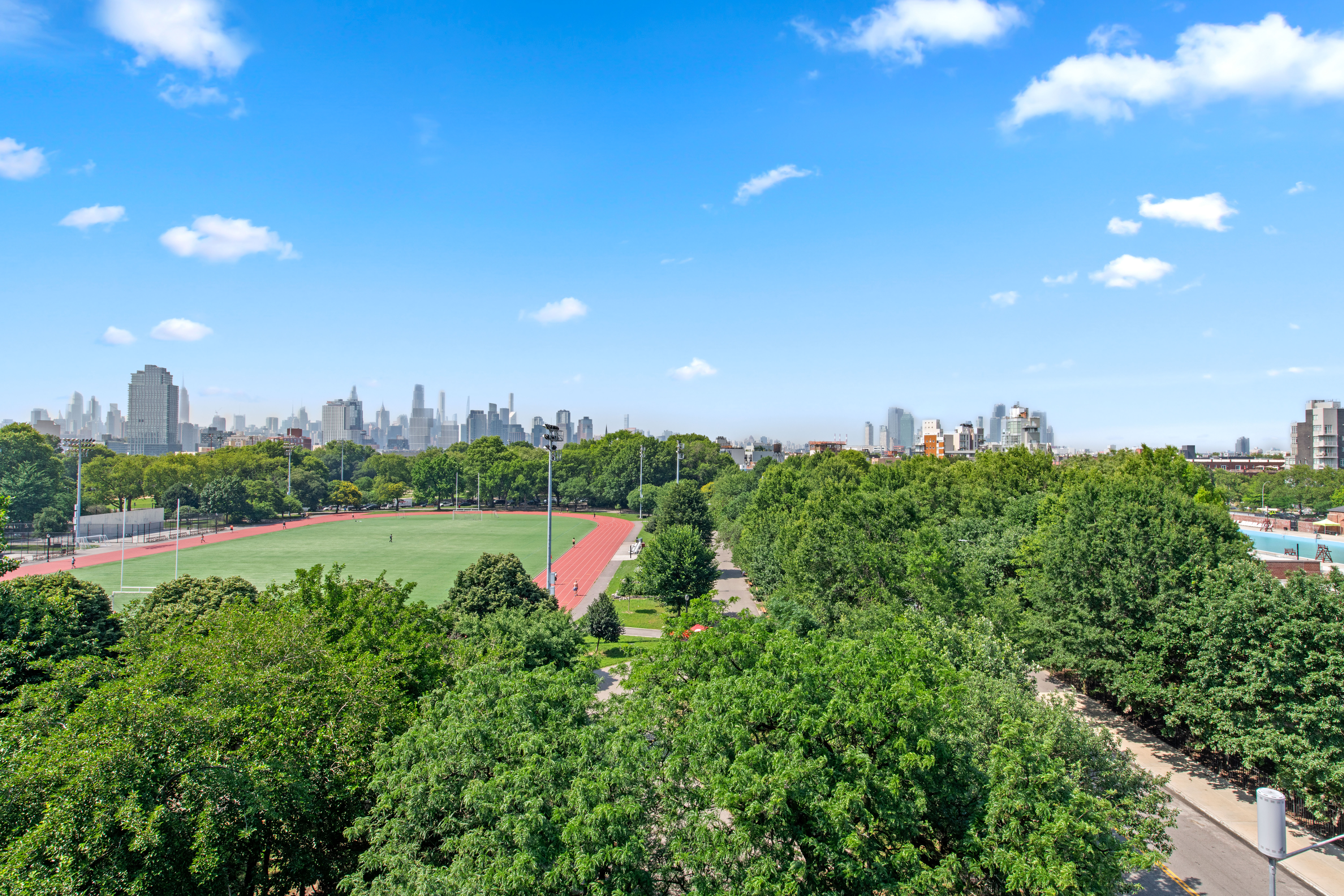 50 Bayard Street, Unit 1B Brooklyn, NY 11211 - Photo 6 of 13 a view of a swimming pool with a yard