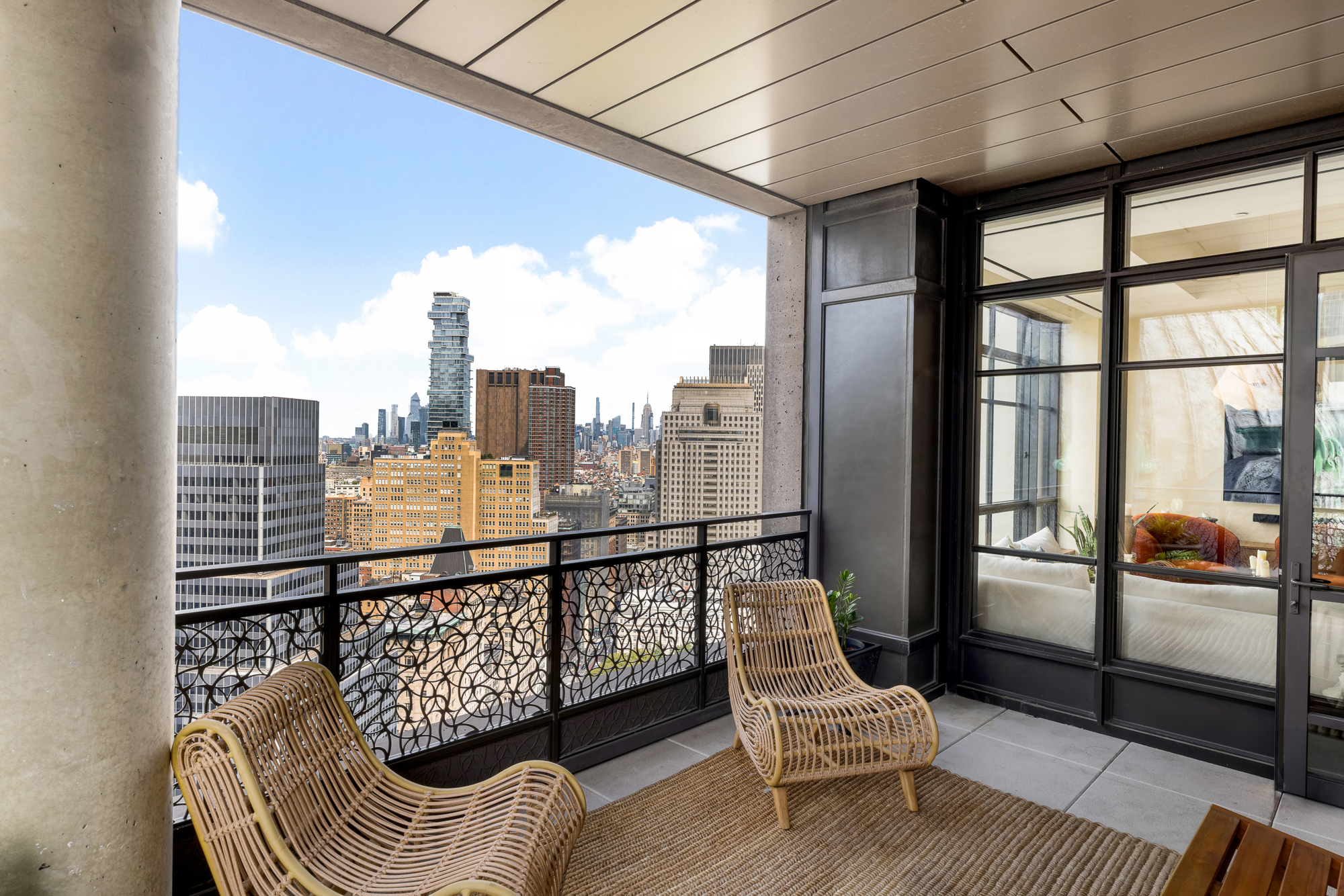25 Park Row, Unit 29A Manhattan, NY 10038 - Photo 10 of 23 a view of a balcony with chair