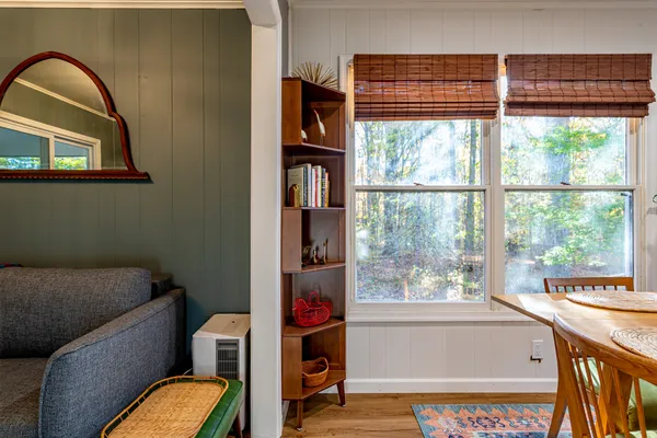 a view of a dining room with furniture window and outside view