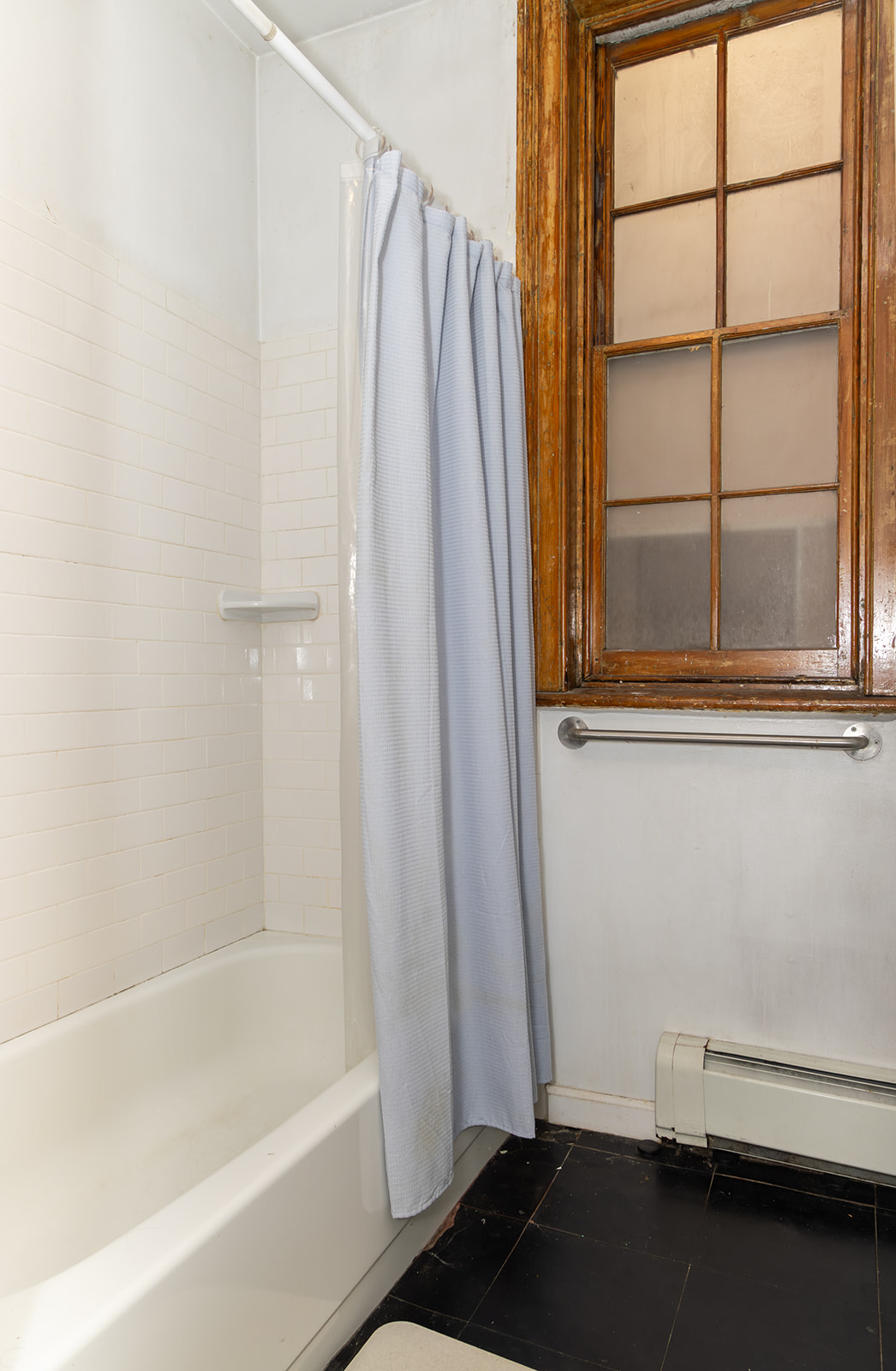 147 Sullivan Street, Unit 2A Manhattan, NY 10012 - Photo 7 of 8 a bathroom with a bathtub and a shower
