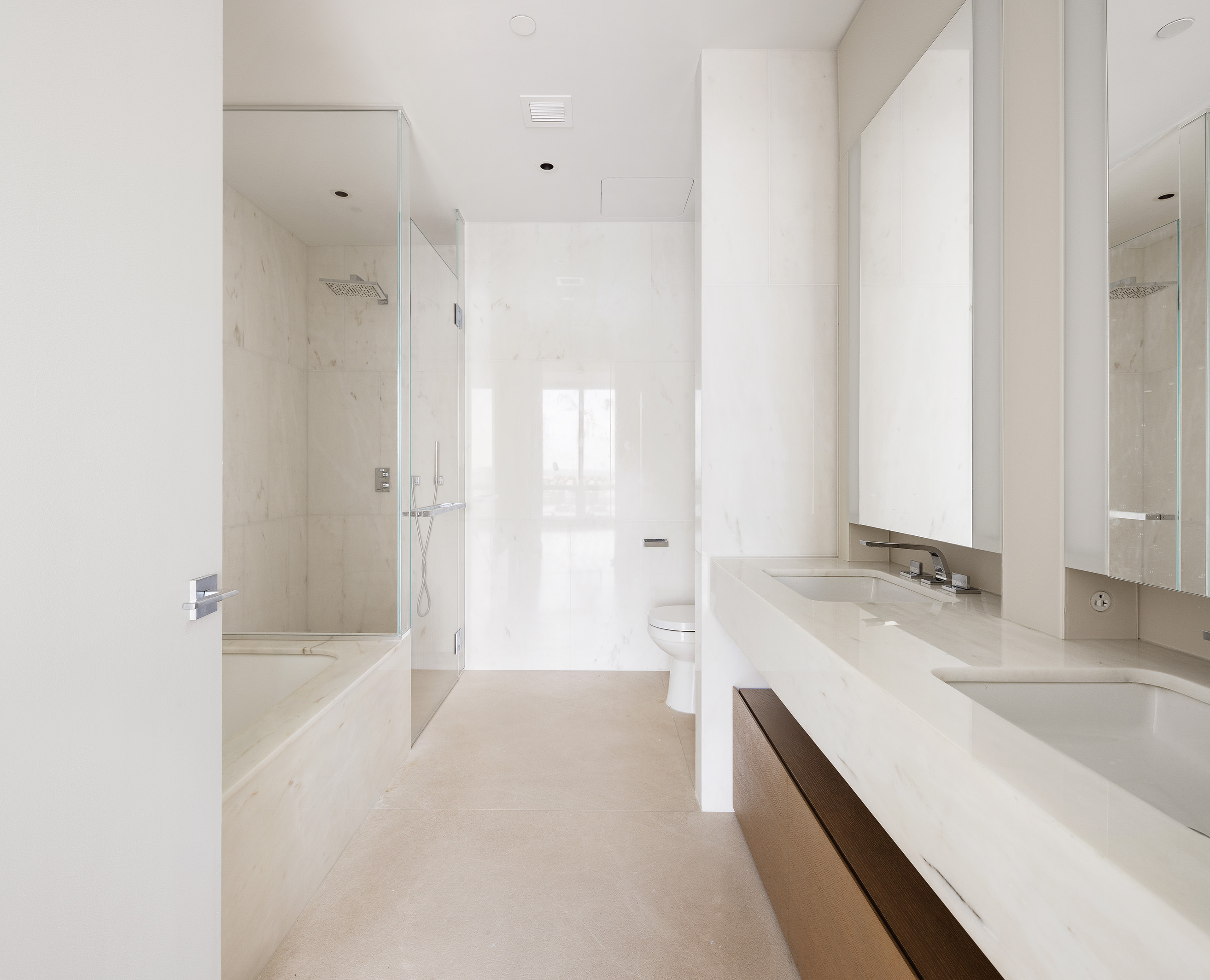 15 Hudson Yards, Unit 29E Manhattan, NY 10001 - Photo 4 of 6 a bathroom with a granite countertop sink a bathtub and a shower
