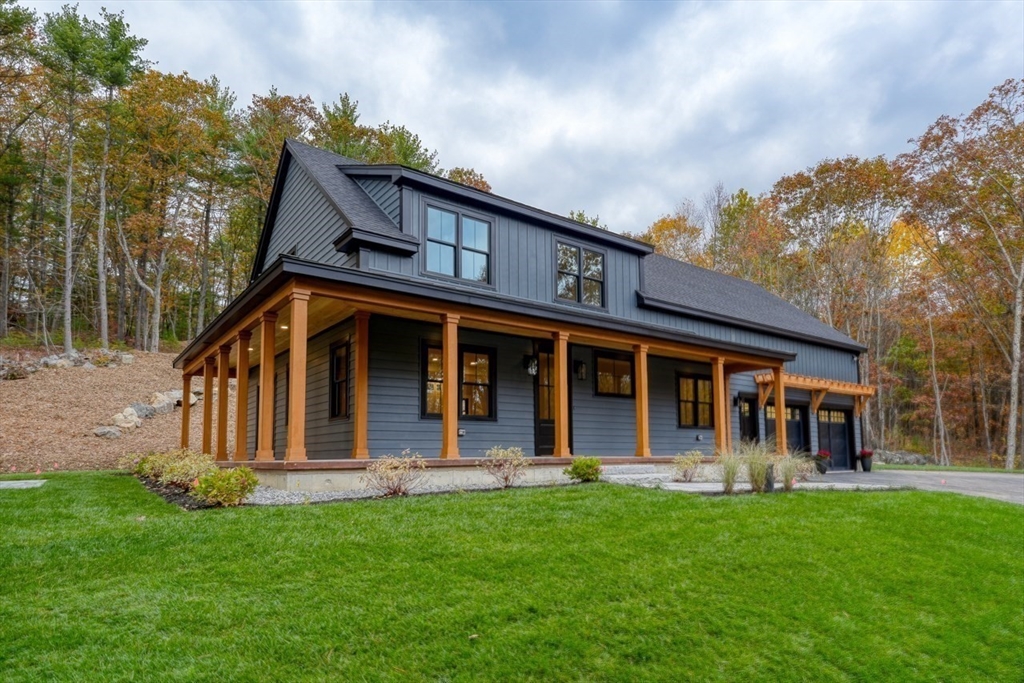171 Randall Road Berlin, MA 01503 - Photo 38 of 41 a front view of a house with garden
