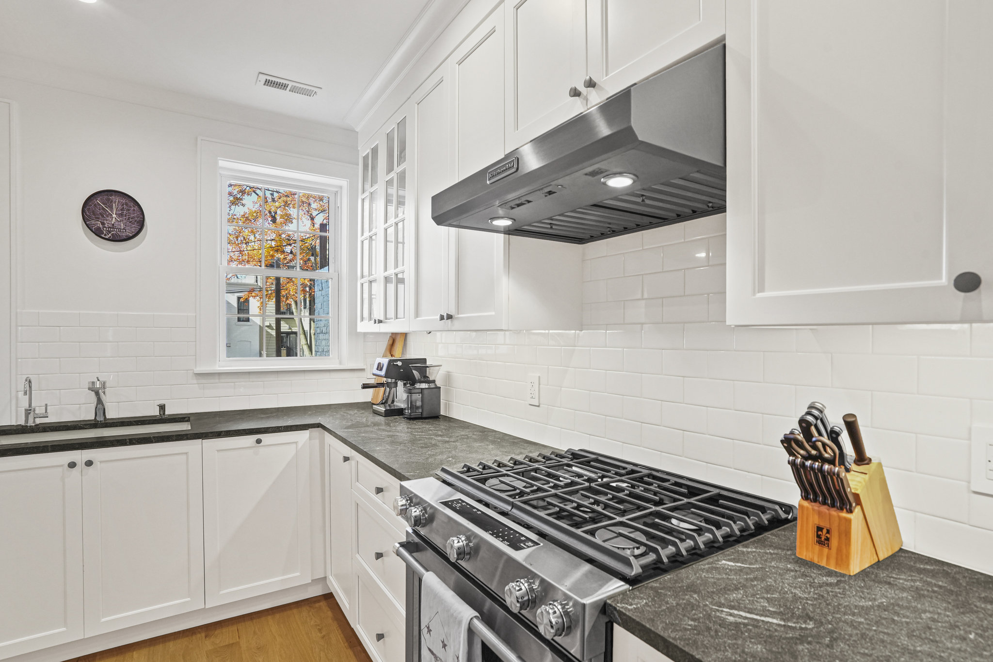 1920 35th Street Northwest Washington, DC 20007 - Photo 5 of 54 a kitchen with stainless steel appliances granite countertop a stove a sink and a microwave