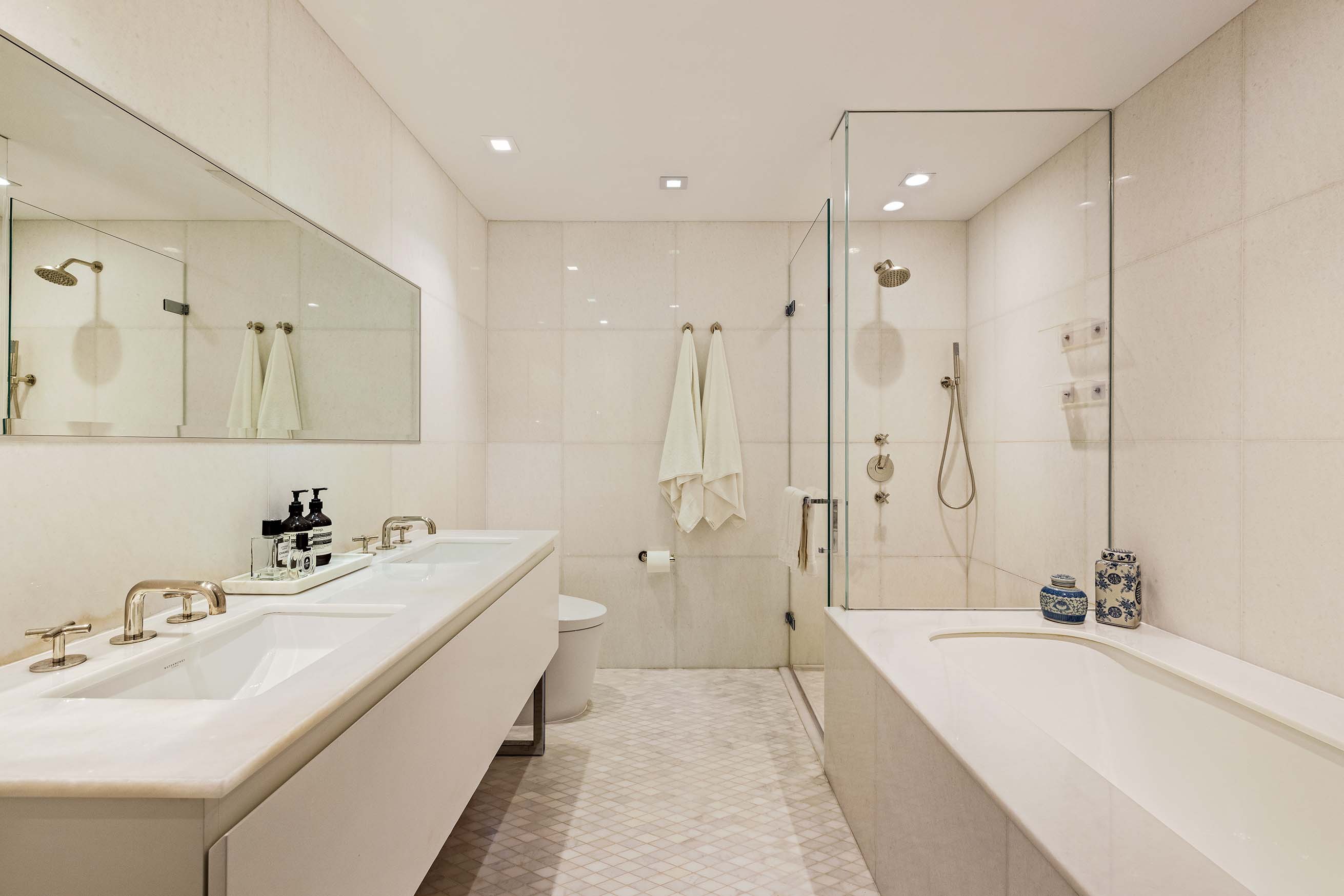 5 Franklin Place, Unit 14A Manhattan, NY 10013 - Photo 11 of 23 a bathroom with a double vanity sink mirror double and bathtub