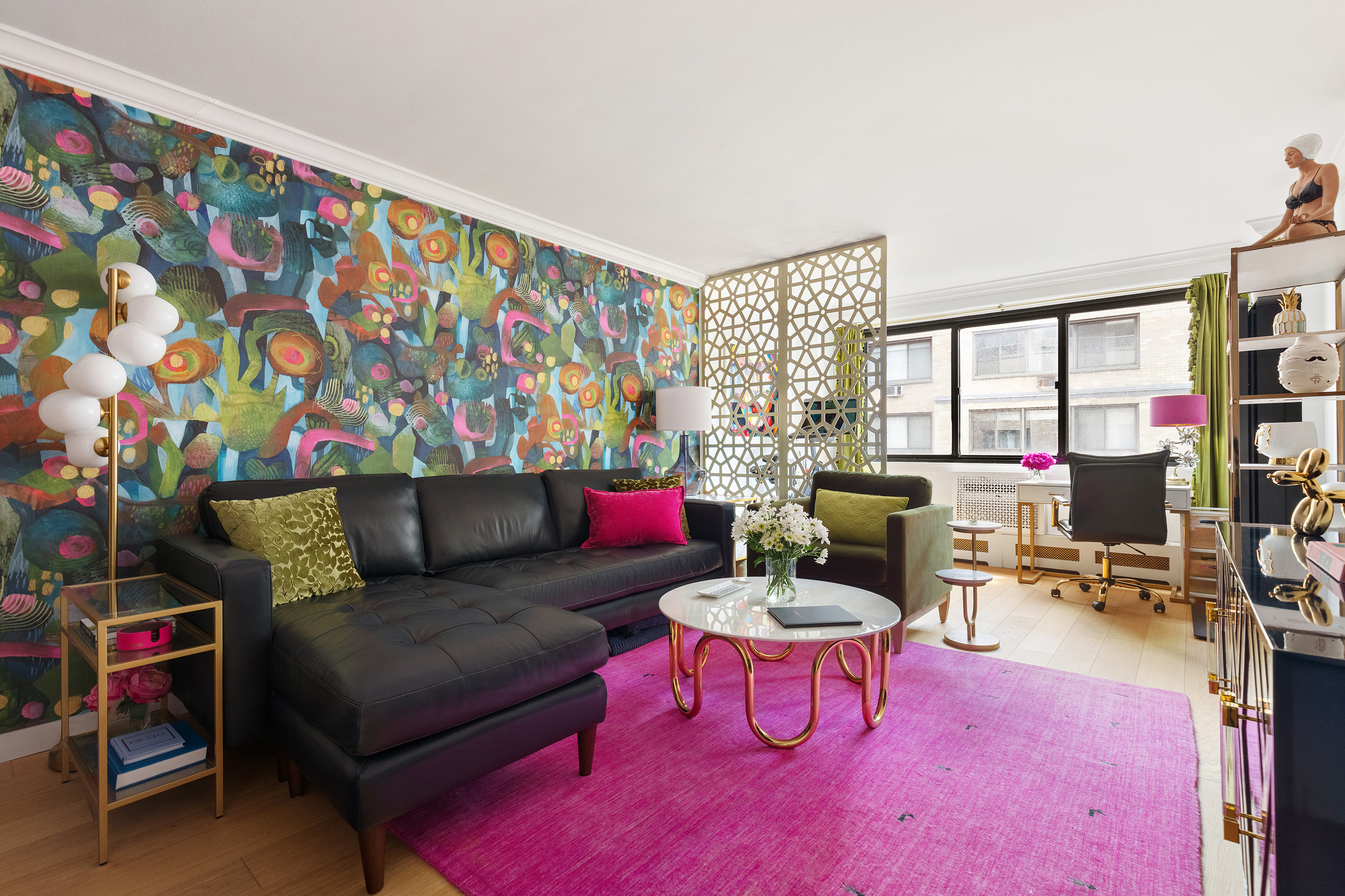16 West 16th Street, Unit 12KN Manhattan, NY 10011 - Photo 1 of 8 a living room with furniture and a flat screen tv