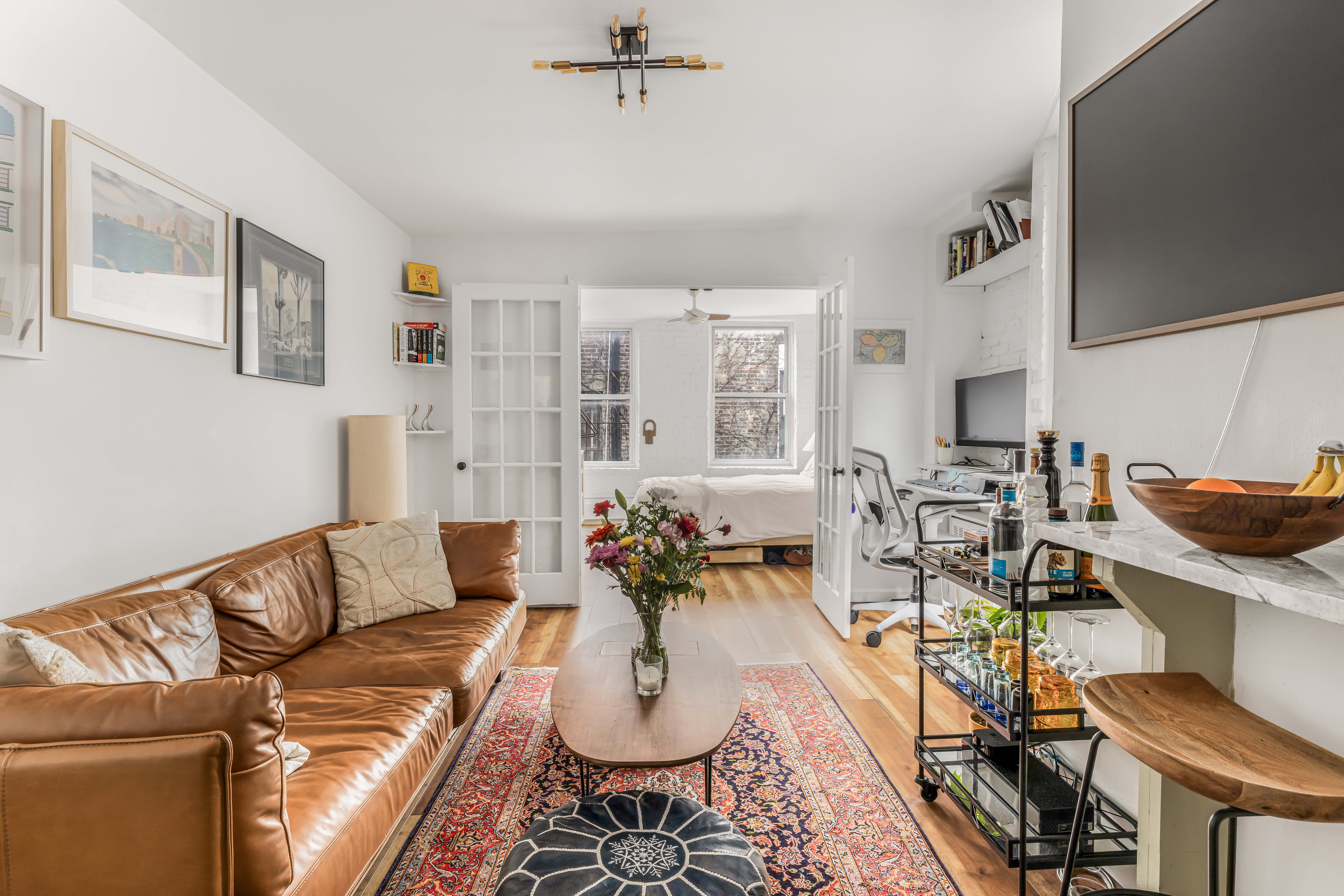 15 Jones Street, Unit 5D Manhattan, NY 10014 - Photo 1 of 7 a living room with furniture