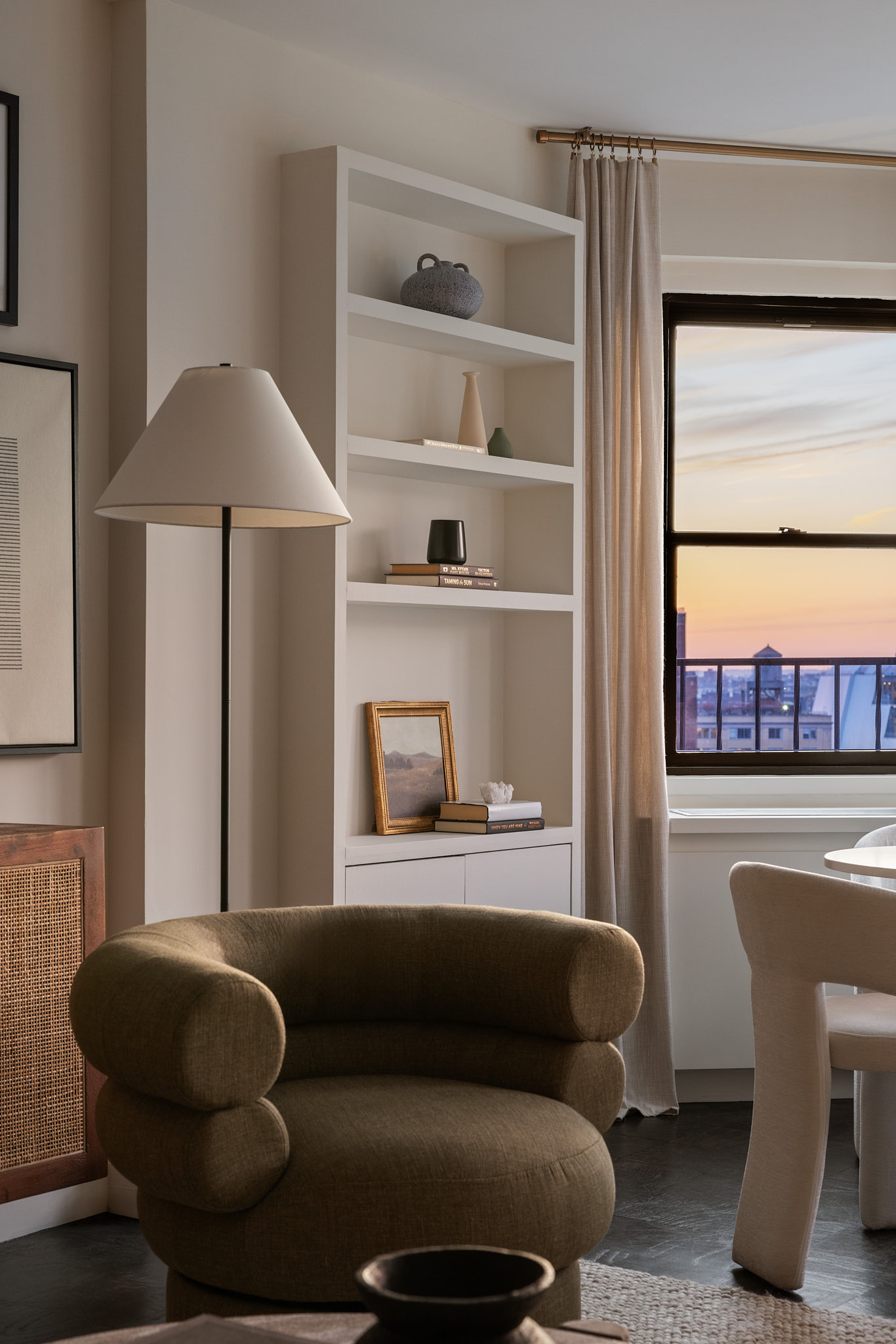31 Jane Street, Unit 16G Manhattan, NY 10014 - Photo 3 of 20 a living room with furniture and a window