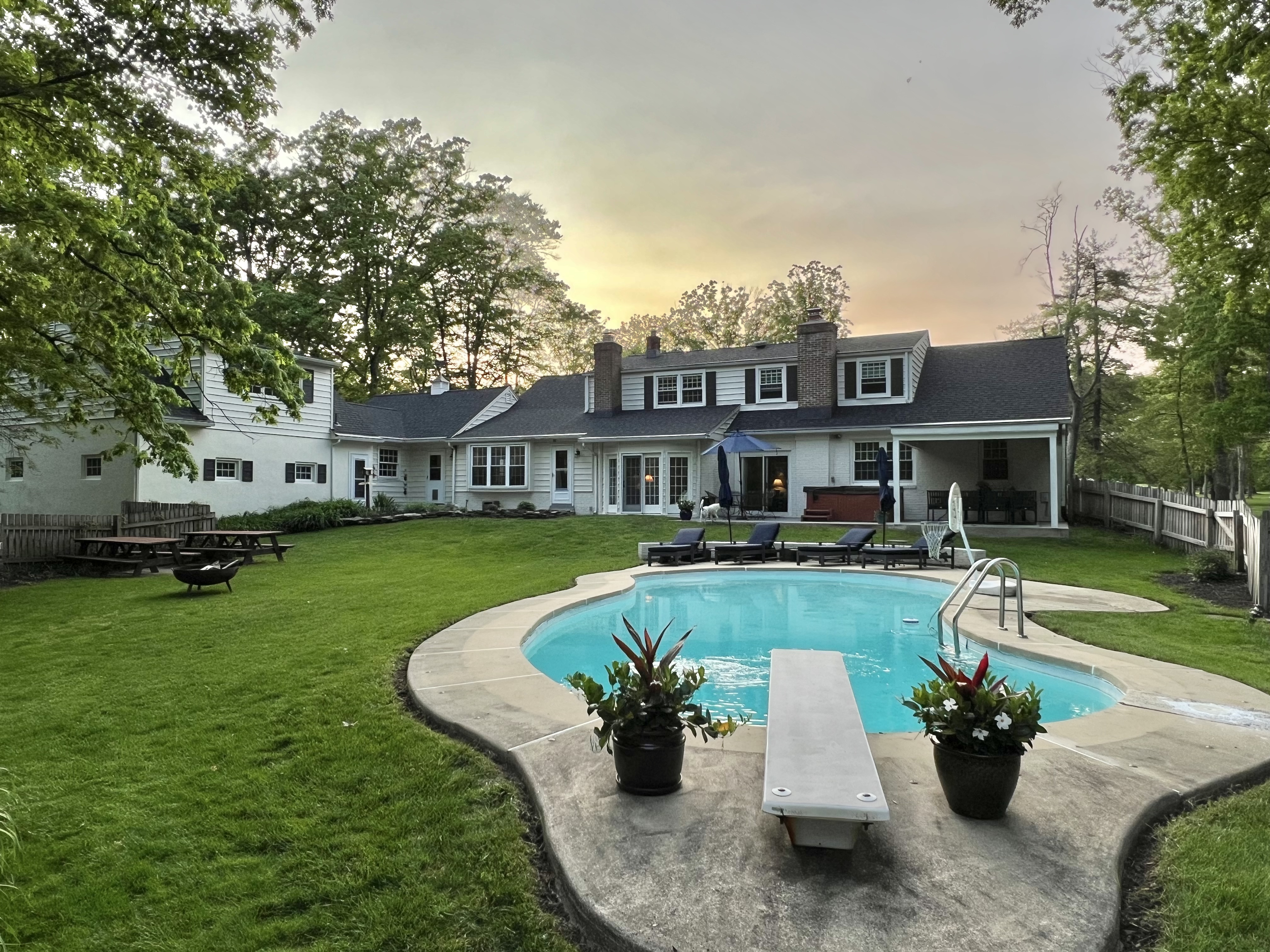 21 Andrews Road Malvern, PA 19355 - Photo 5 of 20 a view of a house with a swimming pool and a chairs in a yard