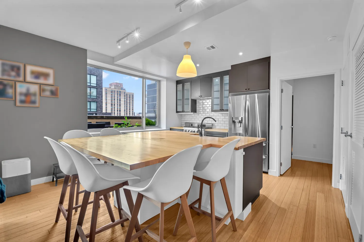 a dining room with furniture and wooden floor