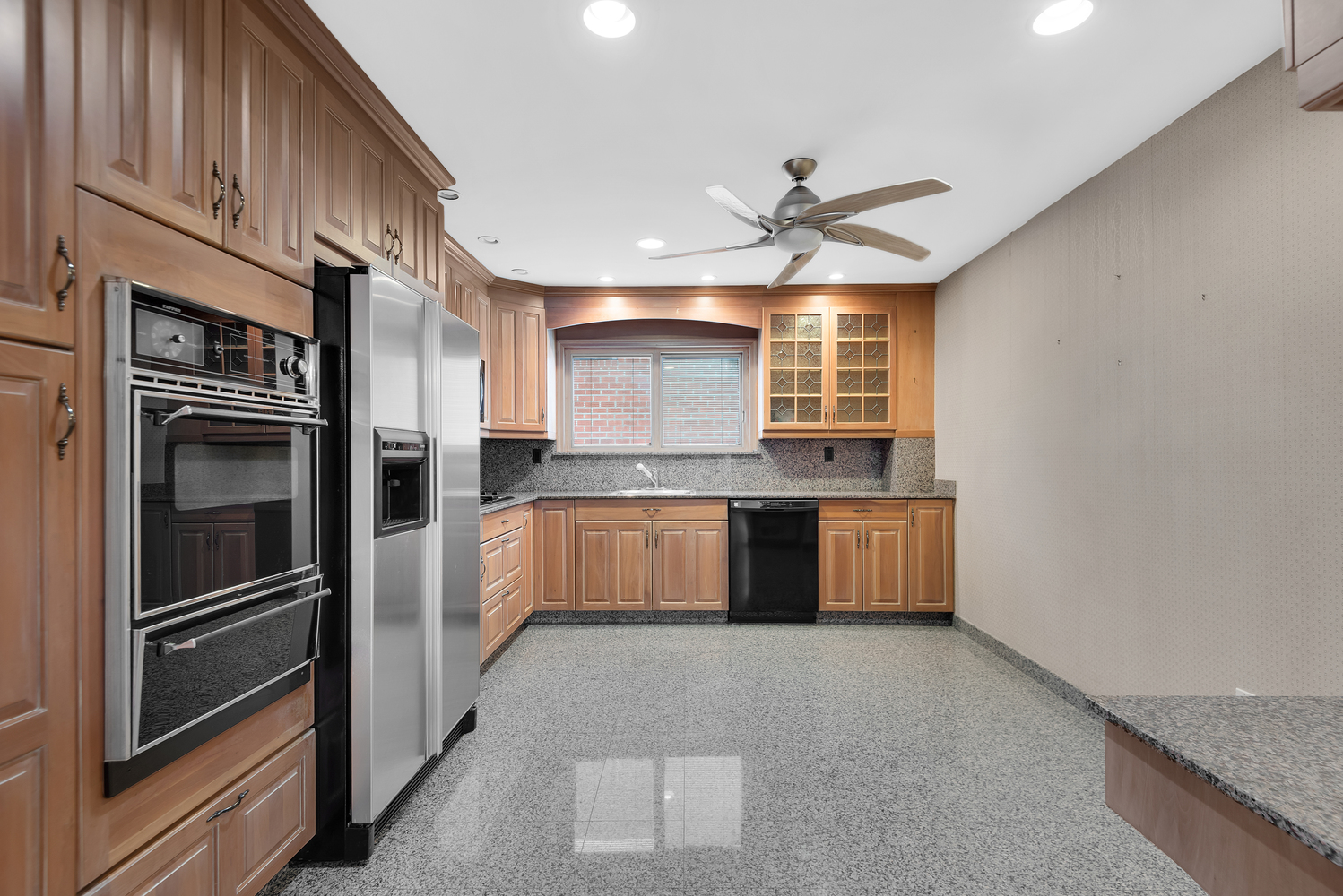 95 83rd Street Brooklyn, NY 11209 - Photo 10 of 18 a view of a kitchen with a sink and stainless steel appliances