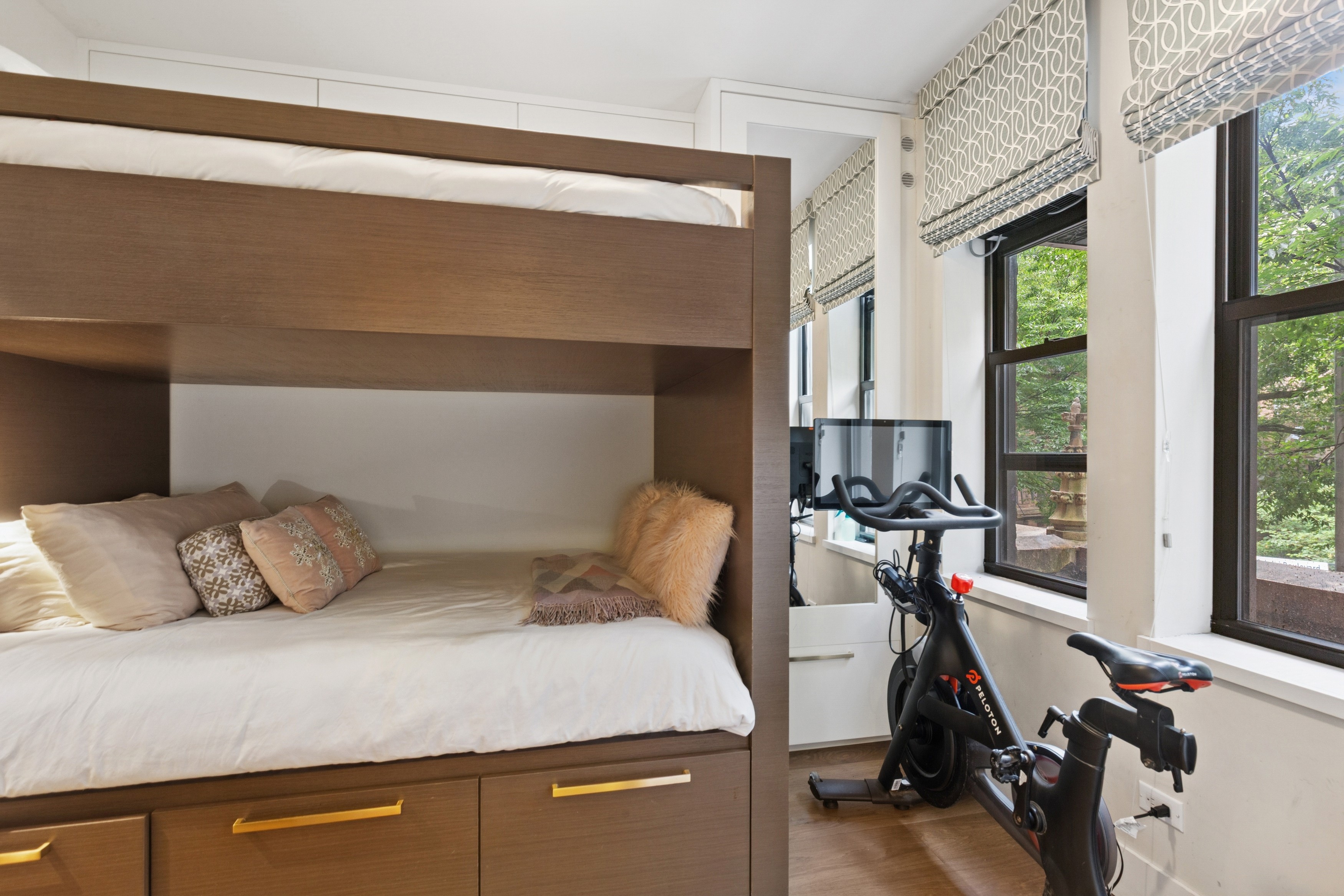 125 Cabrini Boulevard, Unit A22 Manhattan, NY 10033 - Photo 13 of 20 a bedroom with a bed and a large window