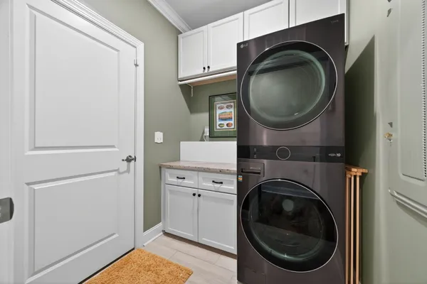 a close view of a utility room with washer and dryer