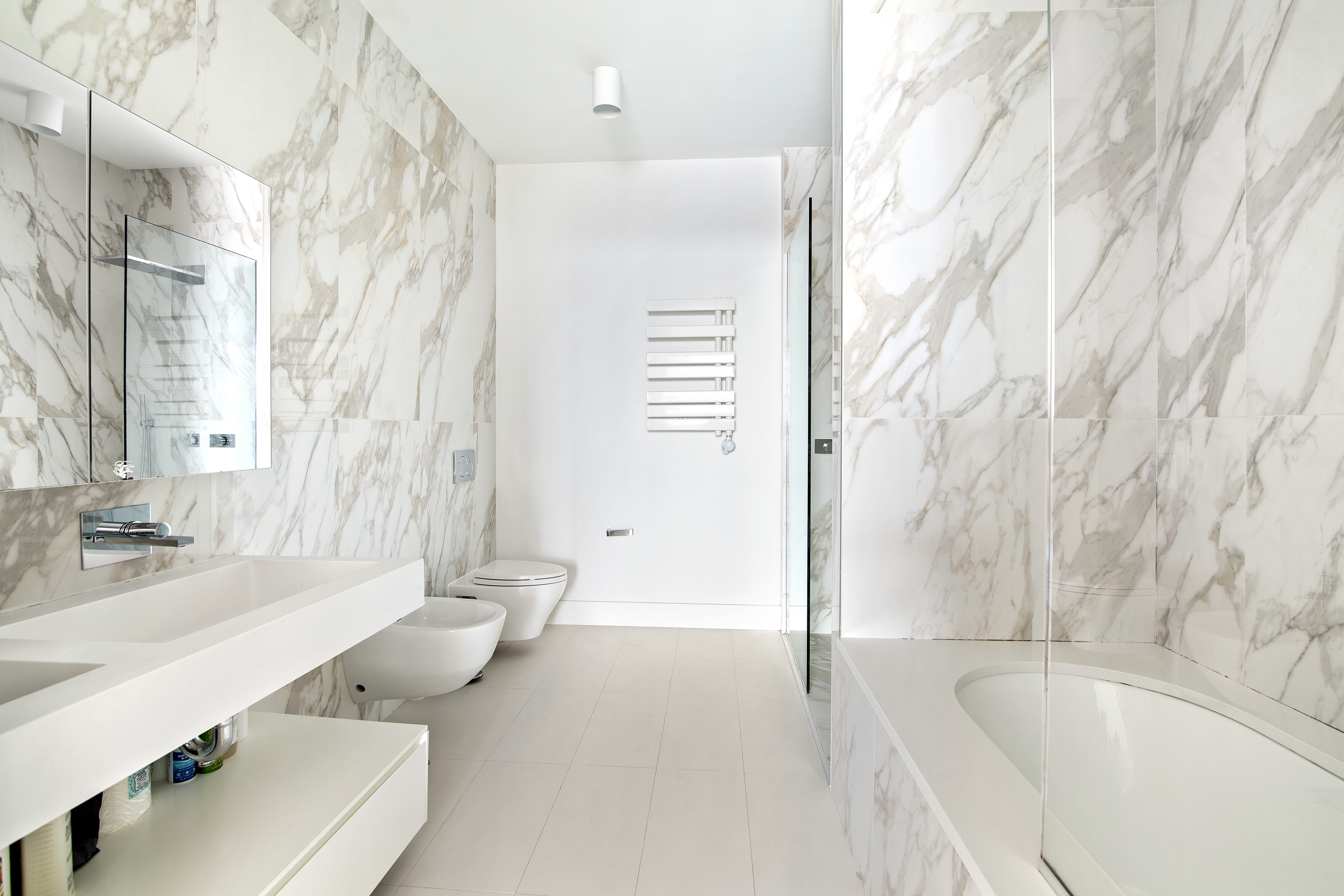 160 Imlay Street, Unit 4E2 Brooklyn, NY 11231 - Photo 6 of 8 a bathroom with a granite countertop sink and a bathtub