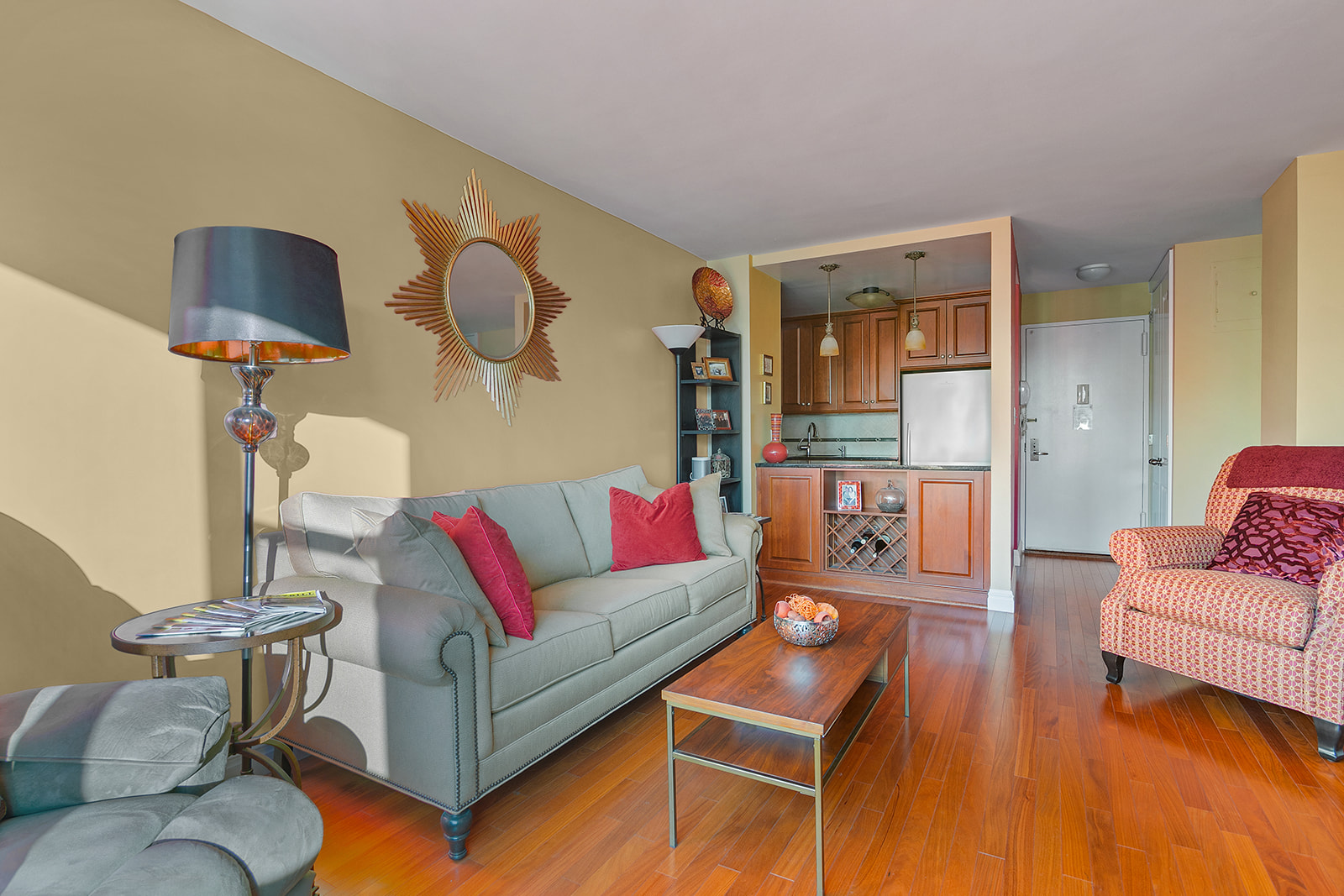 340 East 93rd Street, Unit 27K Manhattan, NY 10128 - Photo 2 of 12 a living room with furniture and a wooden floor
