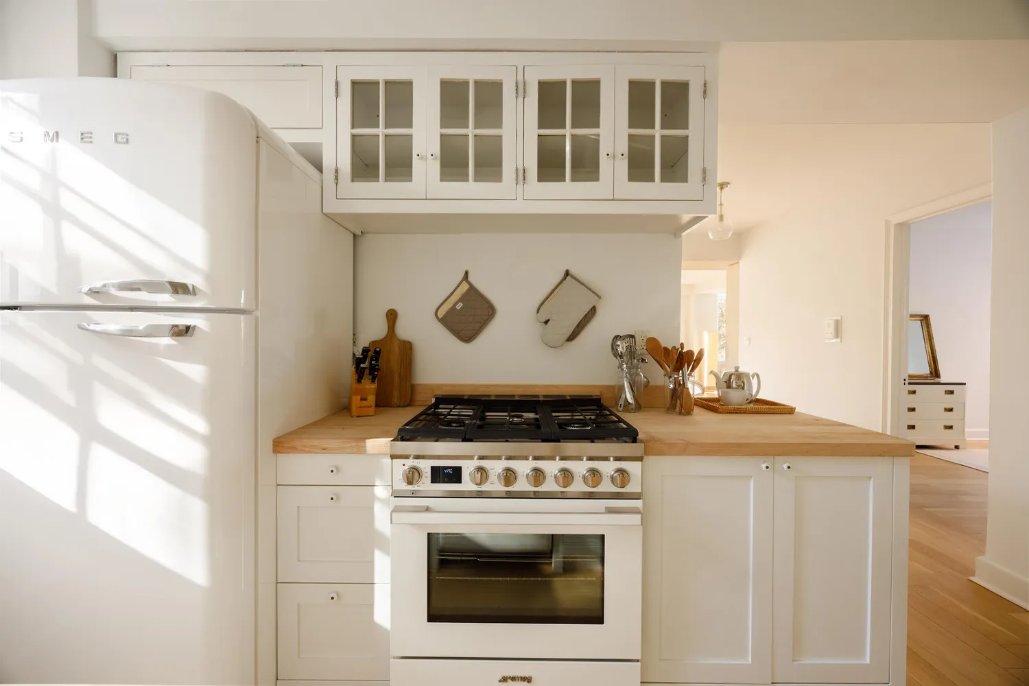 a stove top oven sitting inside of a kitchen