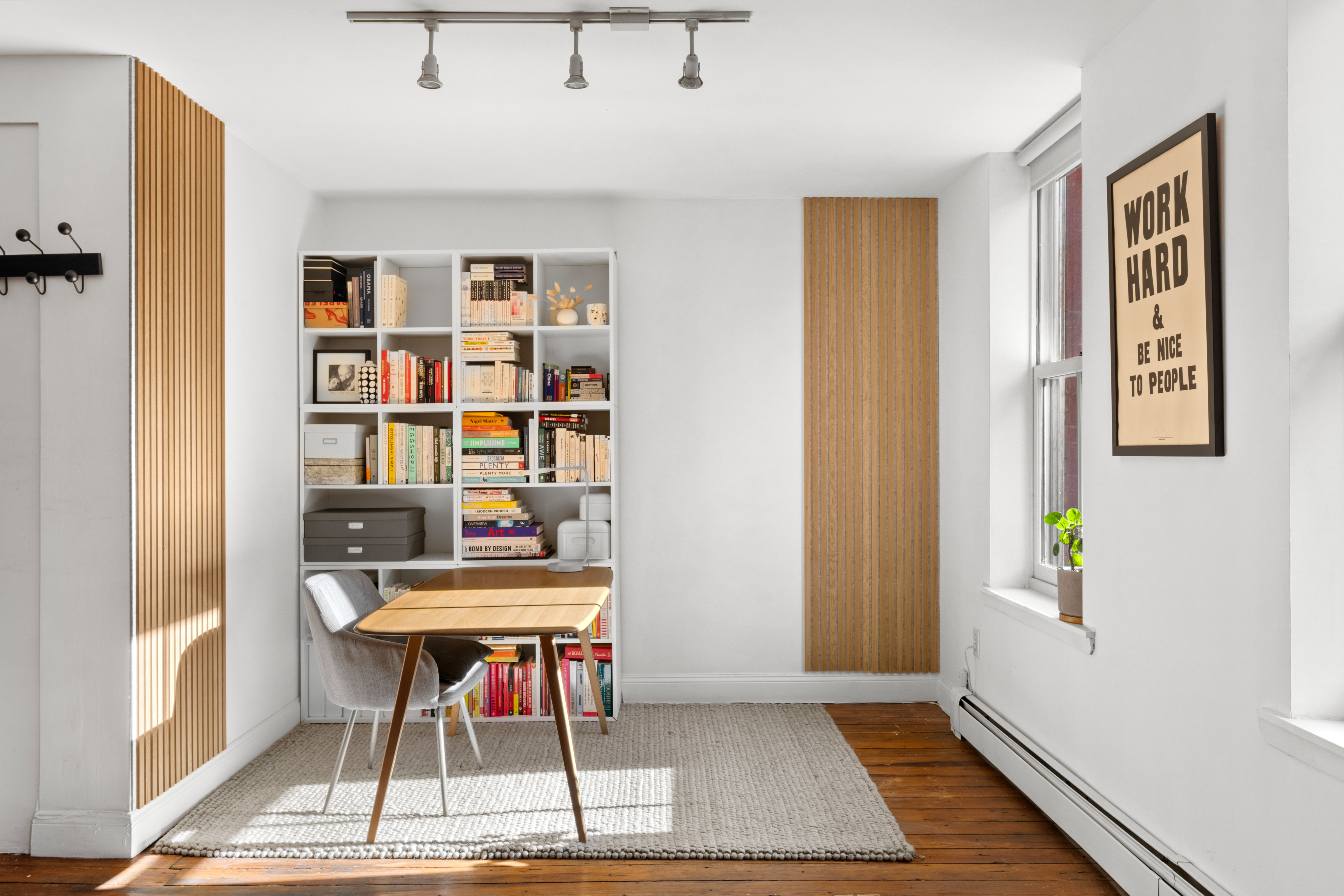 24 Harrison Street, Unit 3 Manhattan, NY 10013 - Photo 4 of 11 a workspace with furniture and rug