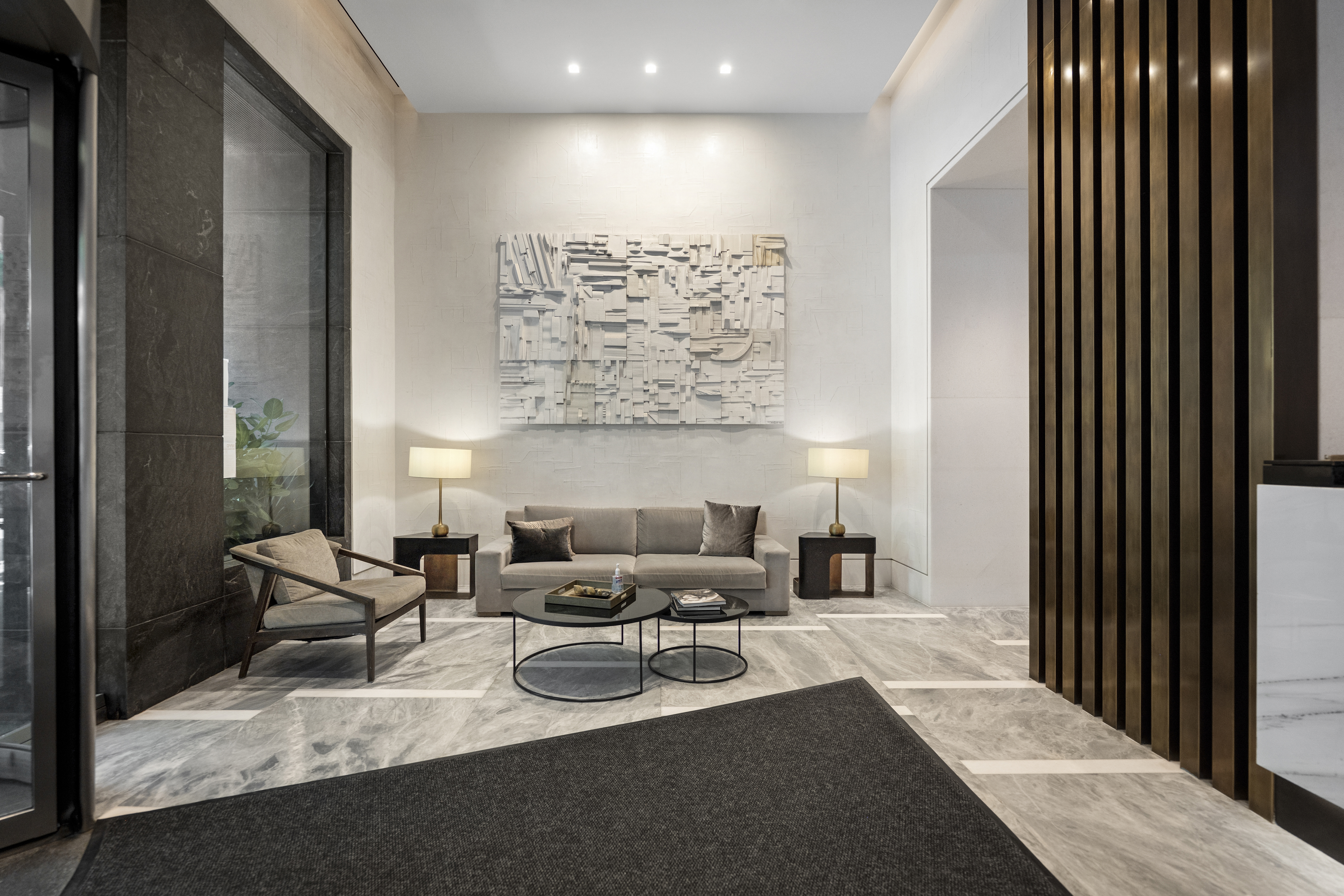 111 West 67th Street, Unit 22B Manhattan, NY 10023 - Photo 9 of 10 a living room with furniture and a large window