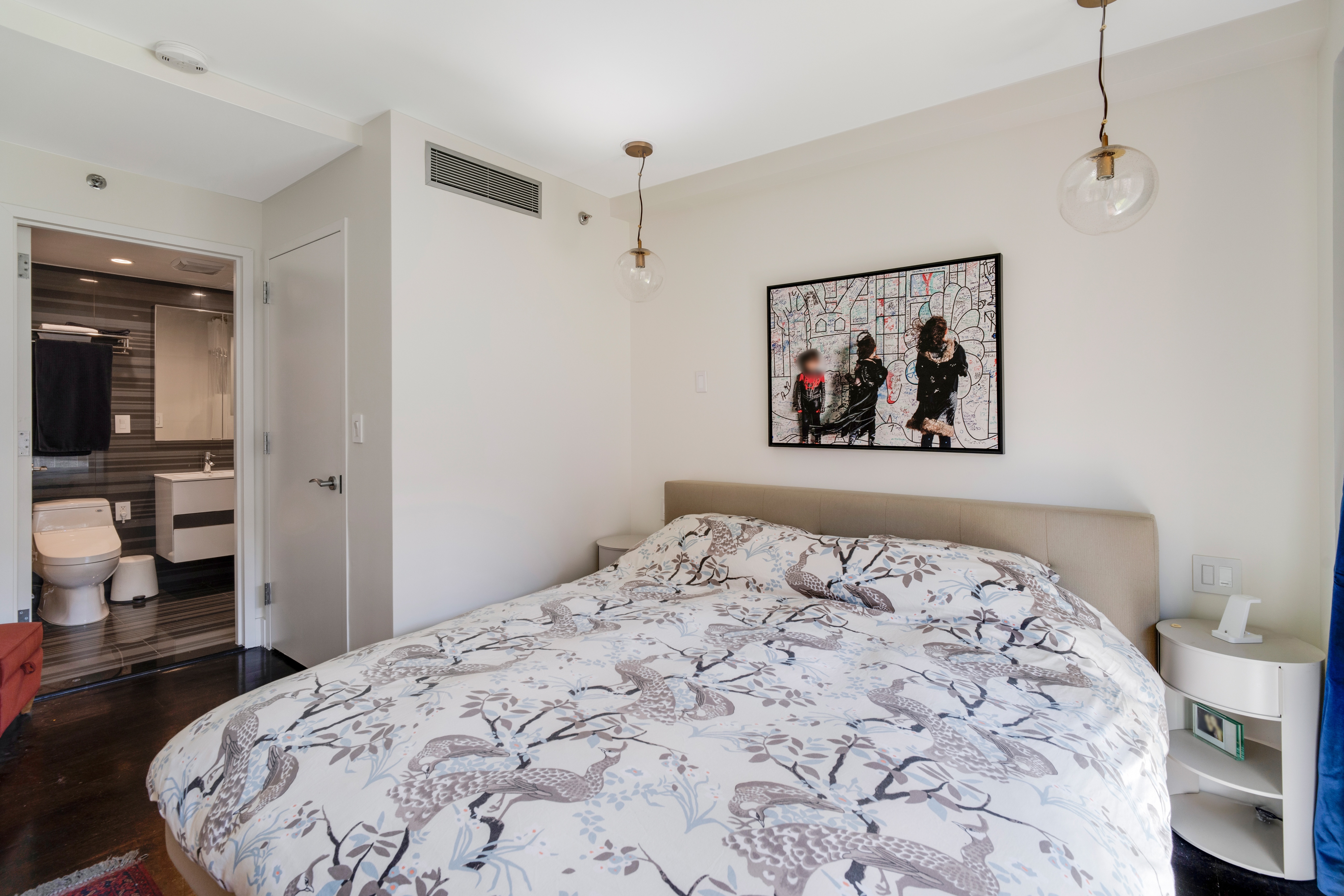 60 Orchard Street, Unit 4 Manhattan, NY 10002 - Photo 8 of 18 a bedroom with a bed and a painting on the wall